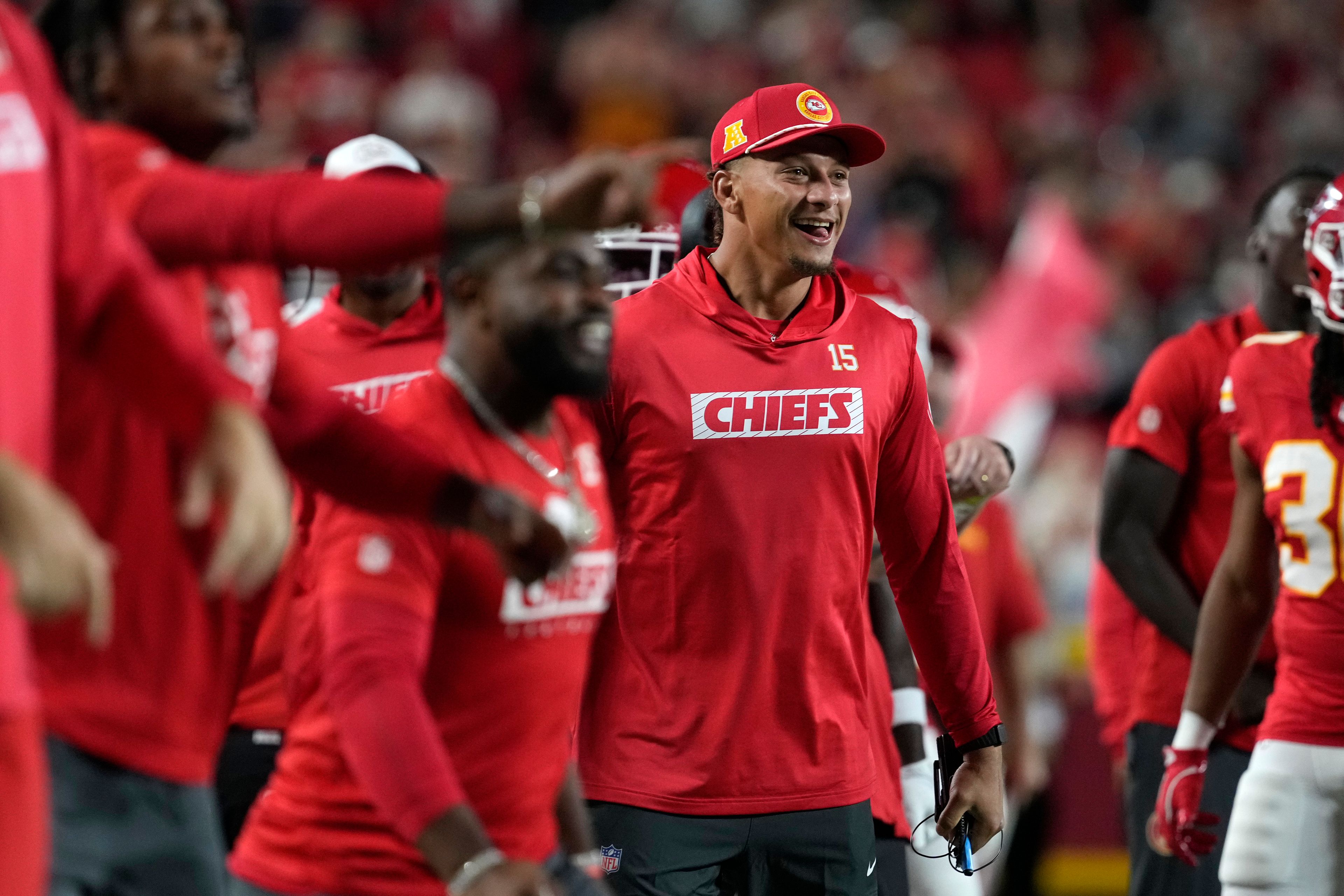 Kansas City Chiefs quarterback Patrick Mahomes celebrates on the sidelines during the first half of an NFL preseason football game against the Chicago Bears Thursday, Aug. 22, 2024, in Kansas City, Mo. (AP Photo/Ed Zurga)