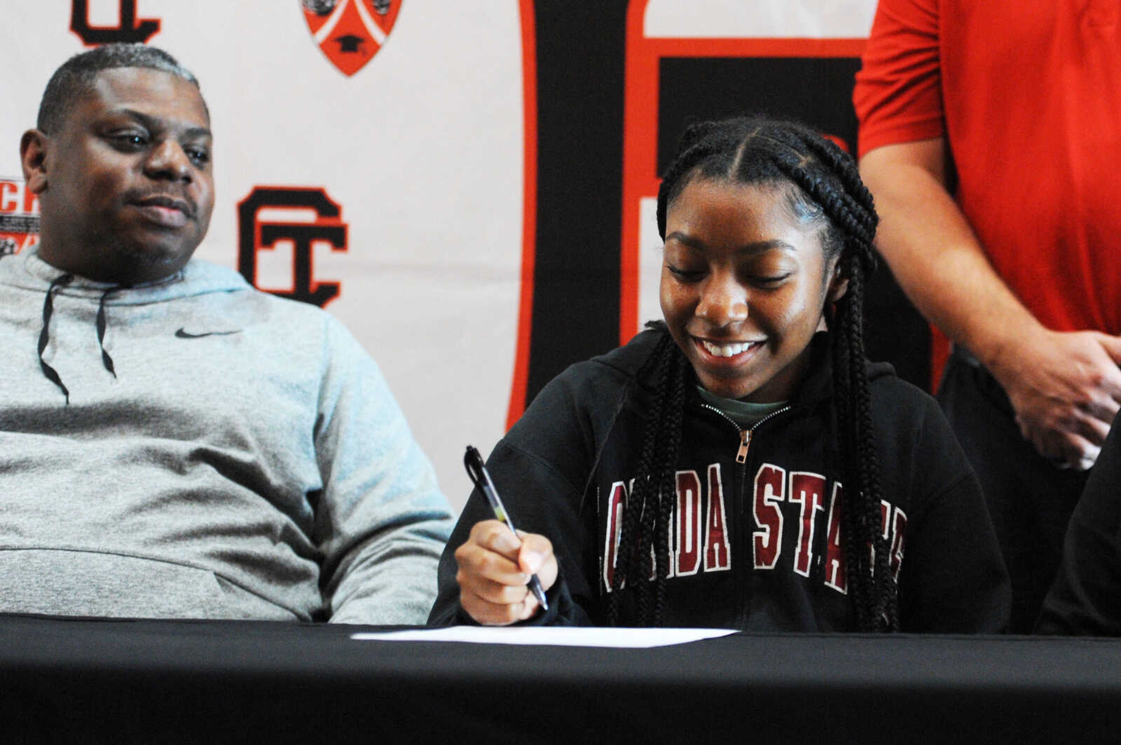 Cape Central's Keri Williams signs a letter of intent to play softball at Mineral Area College on Thursday at Cape Central High School.