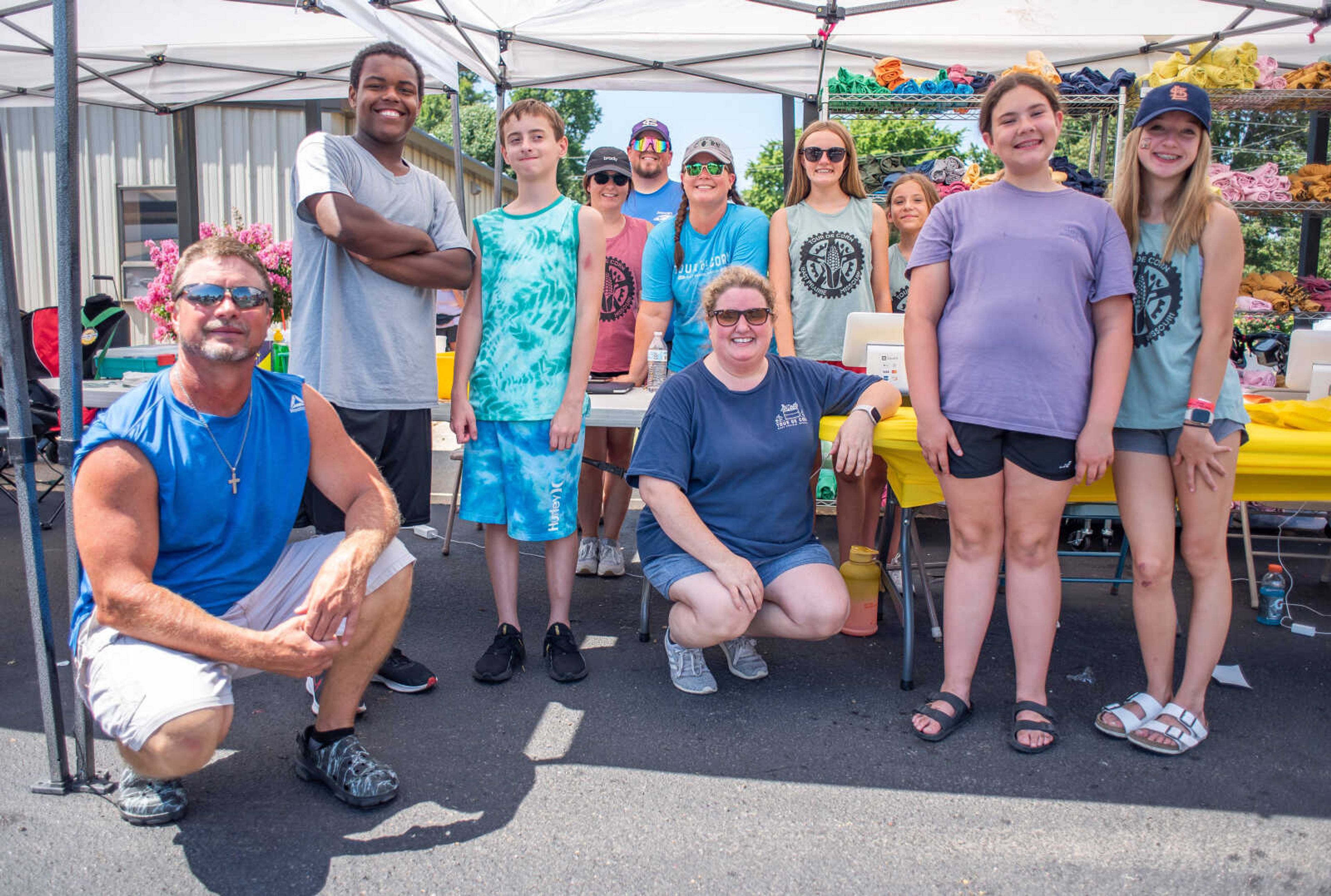 Pictured center, Tour de Corn committee member Emily Dahlbeck, and other ride volunteers pose for a photo in East Prairie, Mo., Saturday, June 25.