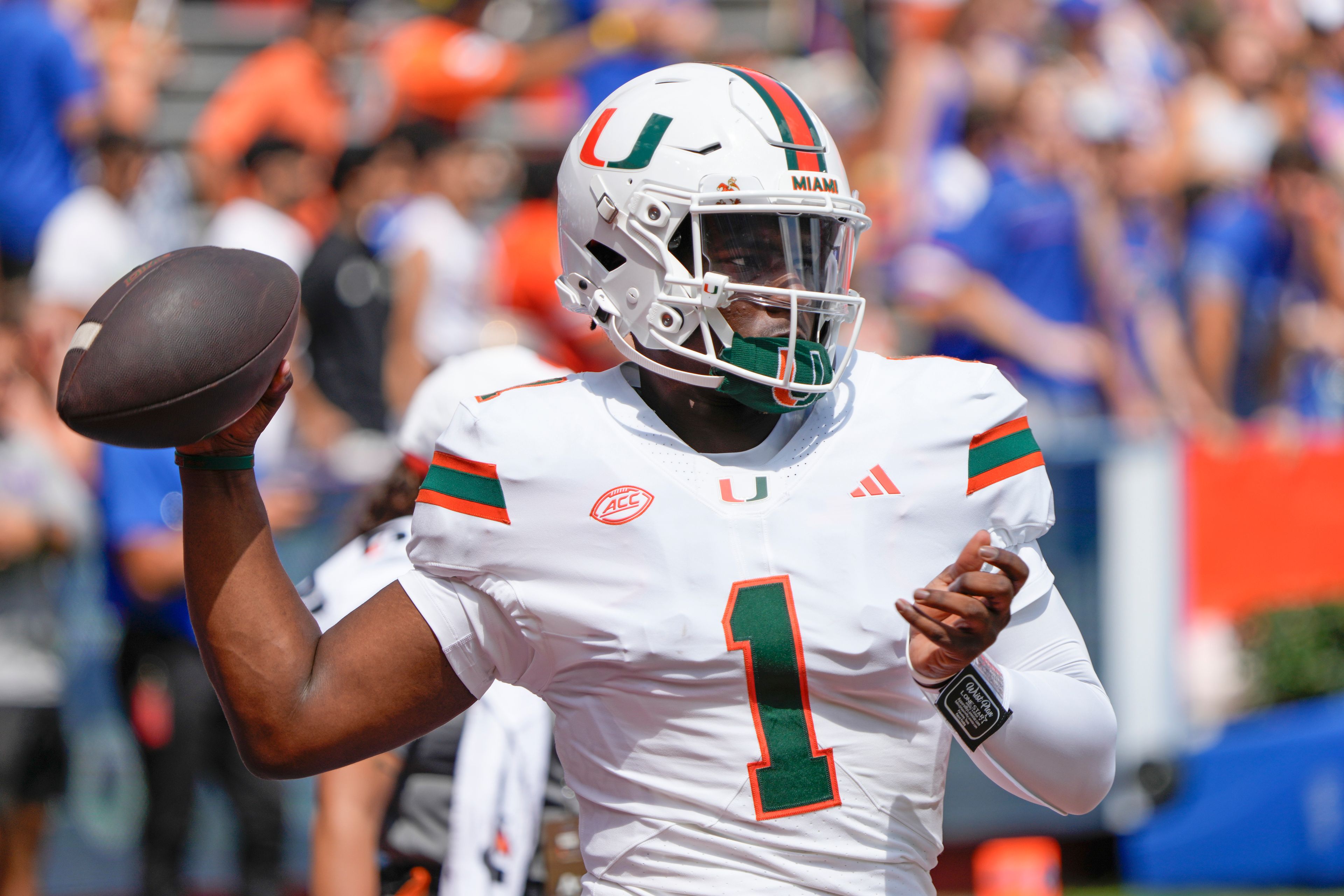 Miami quarterback Cam Ward warms up before an NCAA college football game against Florida, Saturday, Aug. 31, 2024, in Gainesville, Fla. (AP Photo/John Raoux)