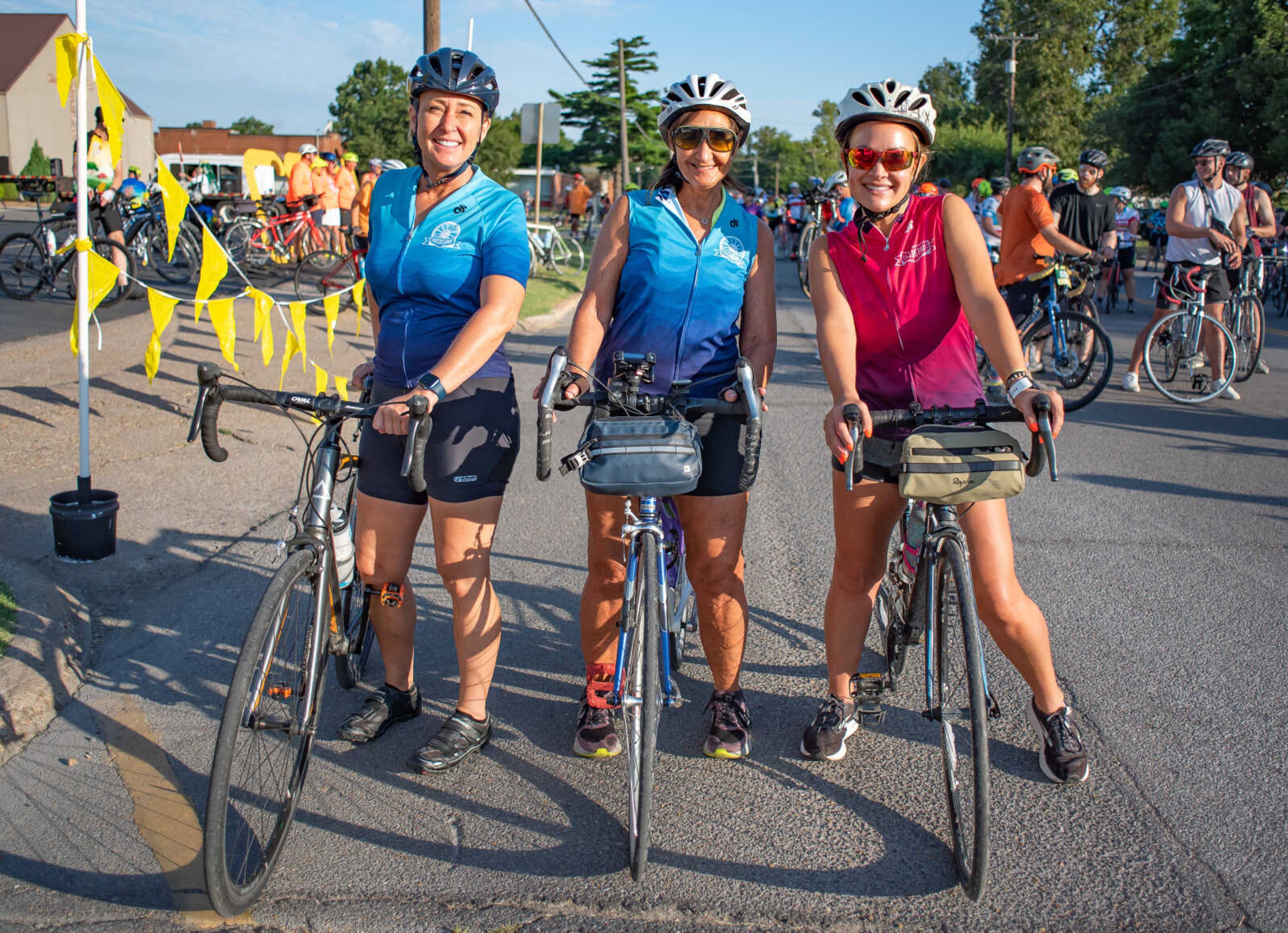 Pictured right, Shaina Williams, and other members of the Chics Dig Bikes cycling club line up to ride the 64-mile route of the Tour de Corn in East Prairie, Mo., Saturday, June 25.