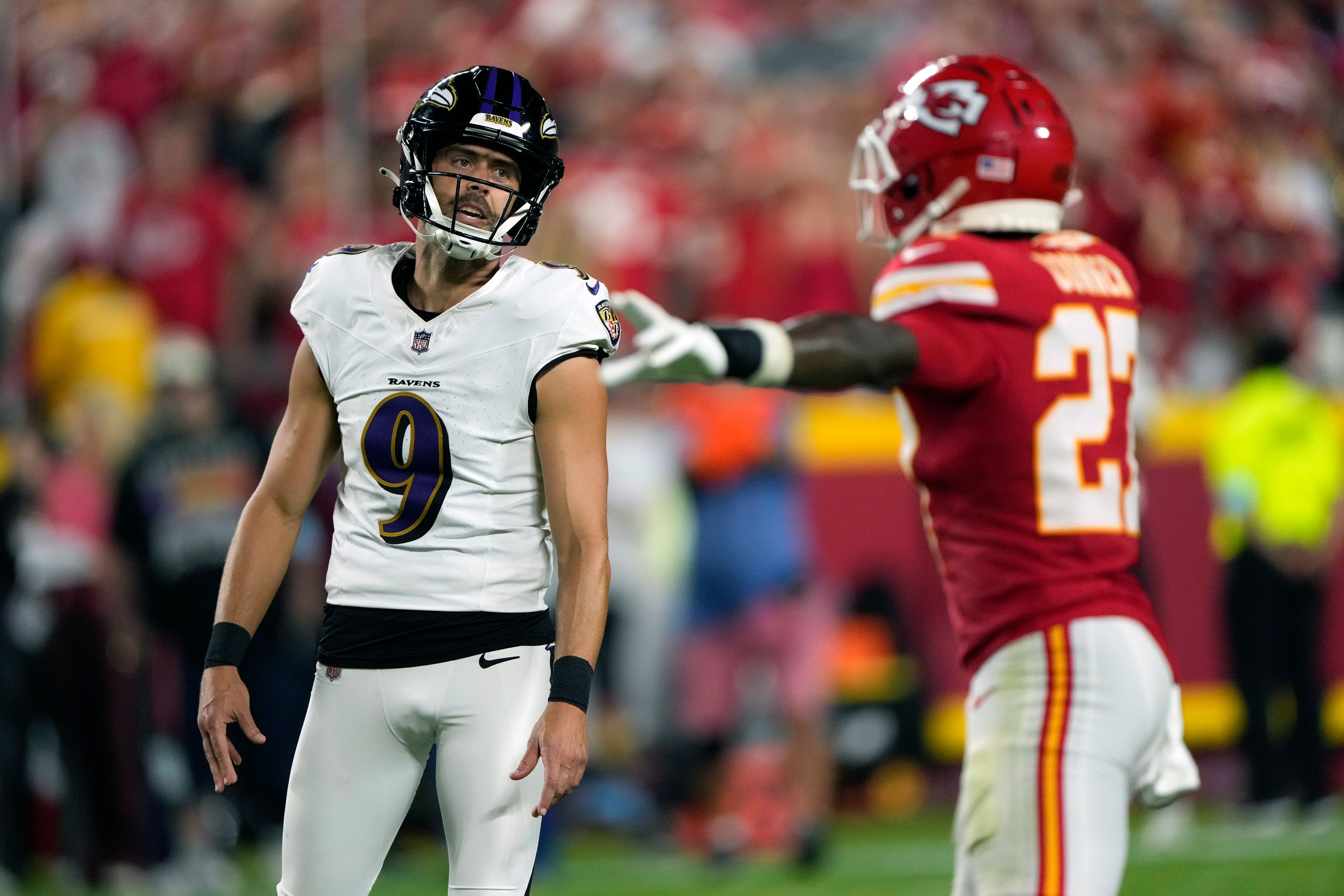 Kansas City Chiefs' Chamarri Conner, right, reacts to a missed field goal attempt by Baltimore Ravens kicker Justin Tucker (9) during the first half of an NFL football game Thursday, Sept. 5, 2024, in Kansas City, Mo. (AP Photo/Charlie Riedel)