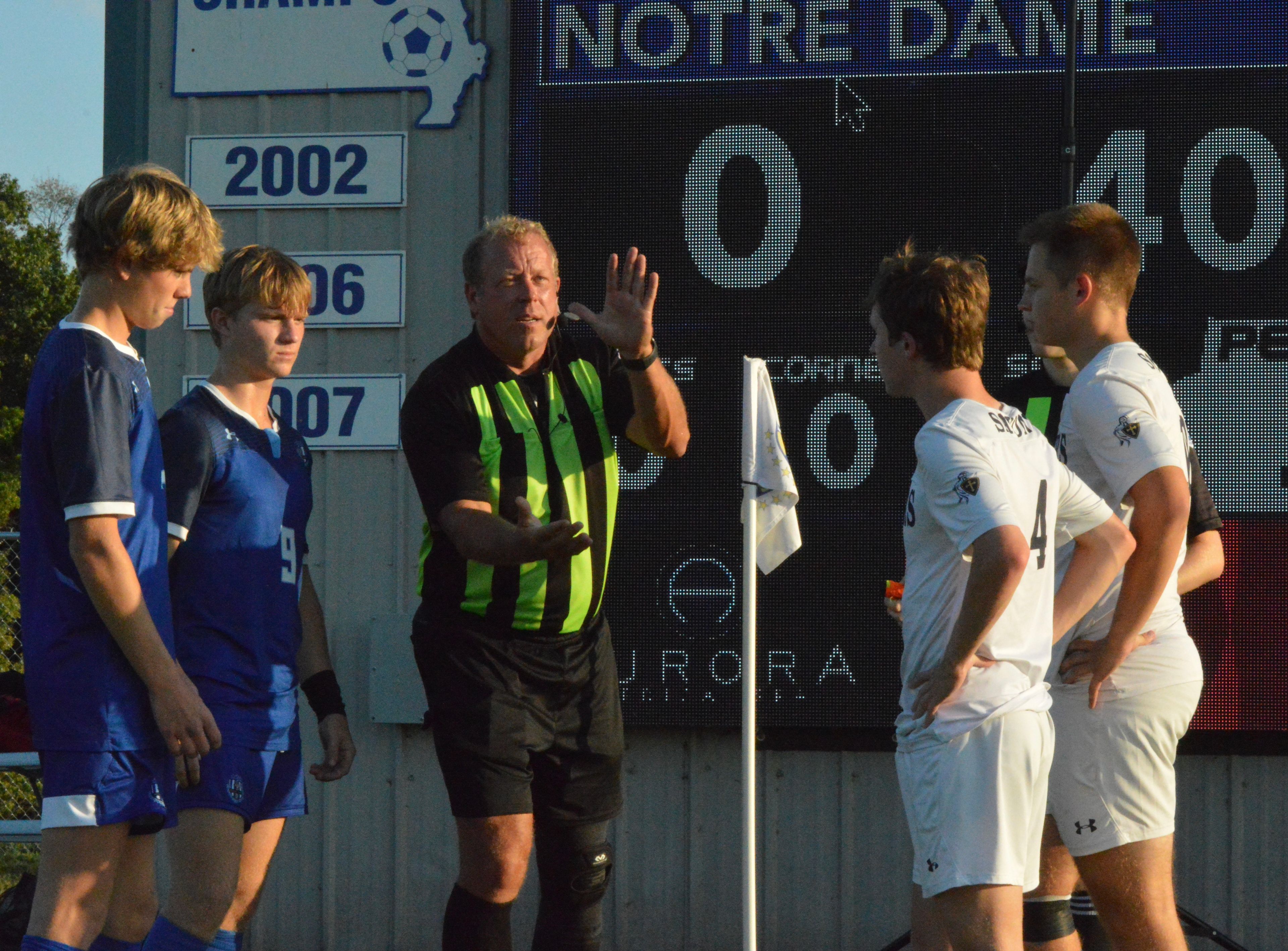 The head official flips the coin ahead of Tuesday evening's showdown between Saxony Lutheran and Notre Dame.