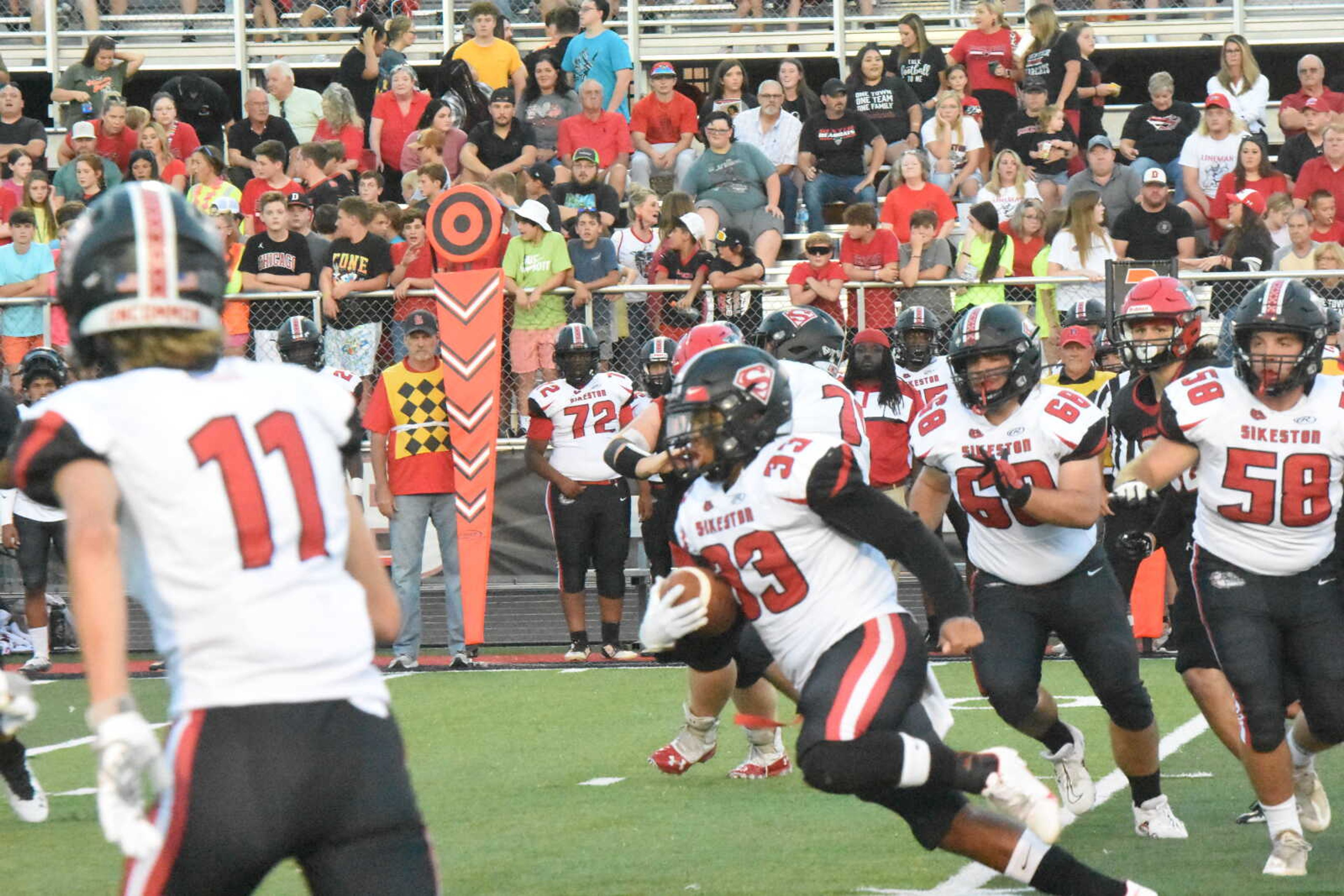 Sikeston running back Keodrick Sherrod (33) heads up field through the Dexter defense in the first quarter.