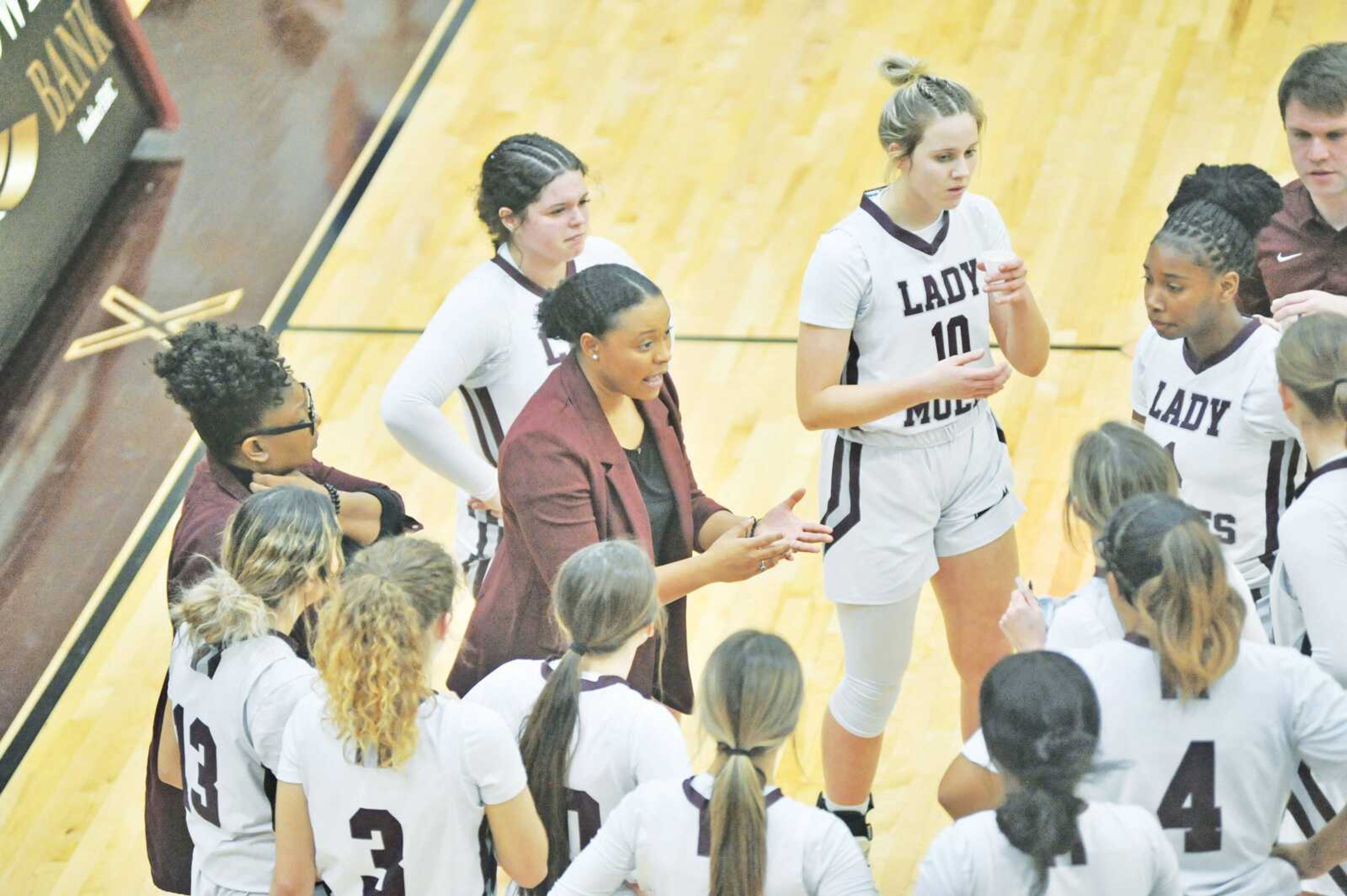 Poplar Bluff head coach Soley Dugas talks to her team during the Lady Mules matchup against Notre Dame on Thursday.