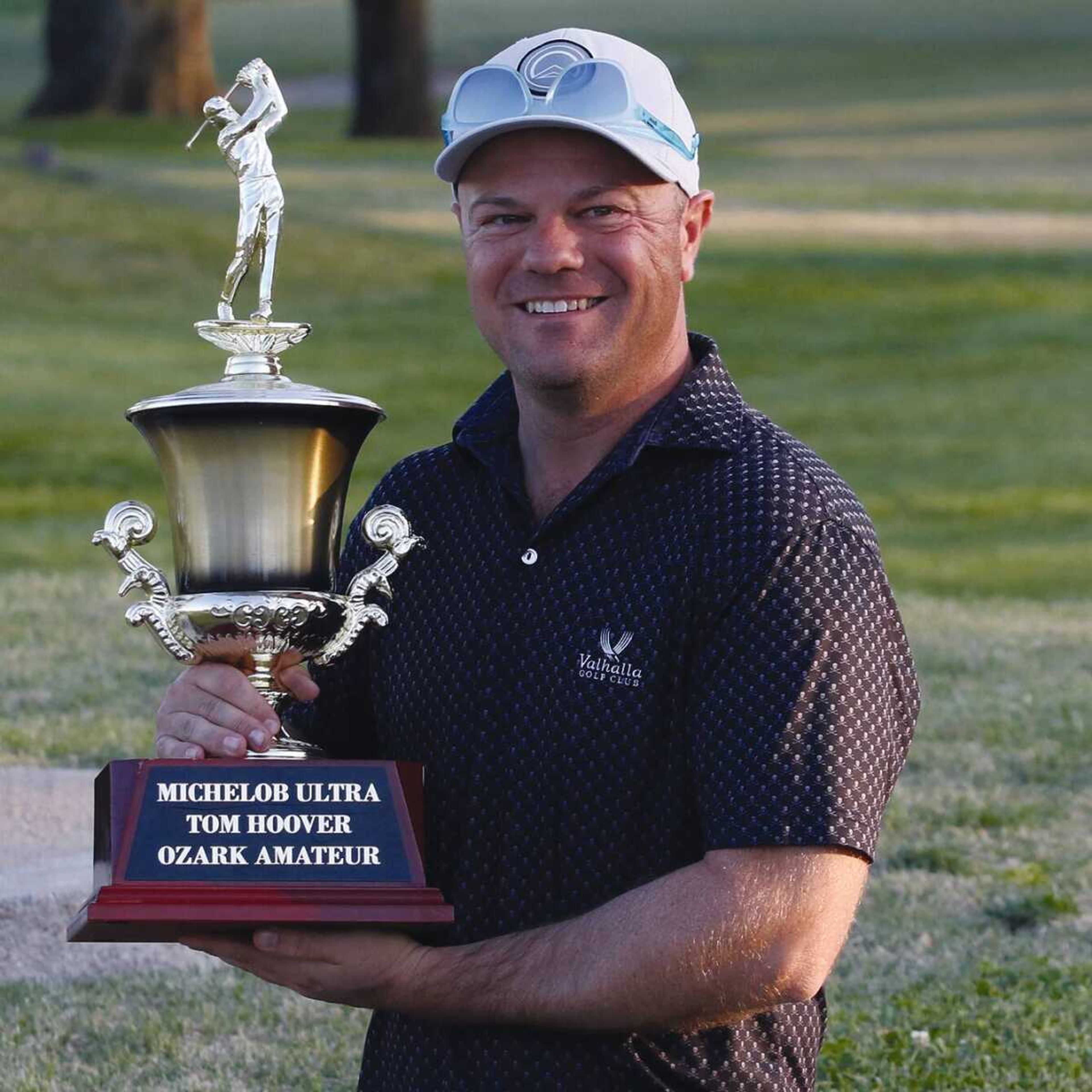 Joshua Rhodes holds the 2023 Tom Hoover Ozark Invitational trophy after he became the 15th golfer to win the tournament more than once. Rhodes previously won the Ozark in 2016.