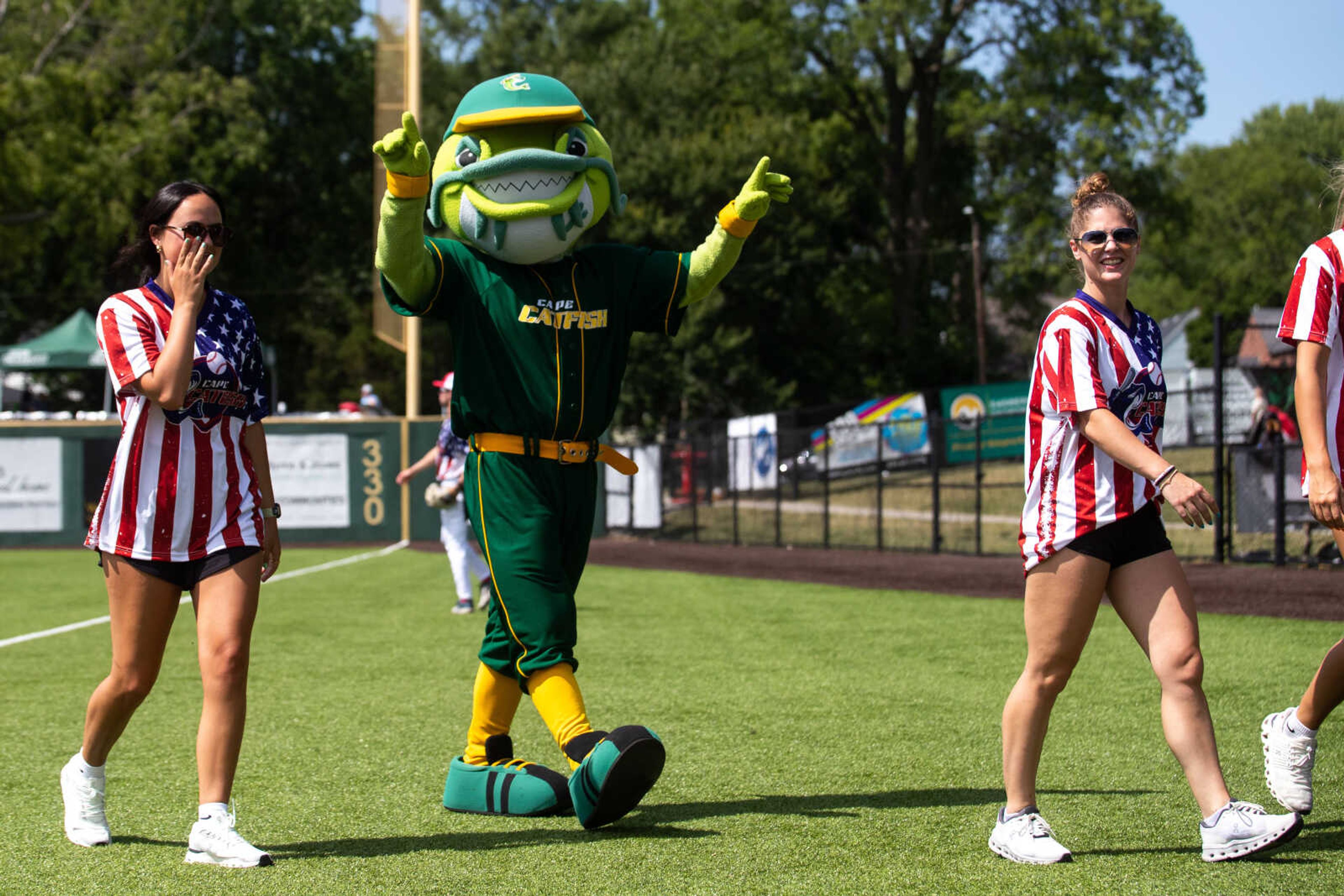 The Cape Catfish mascot reacts after dancing to "Cotton Eyed Joe" with staff members during the game.