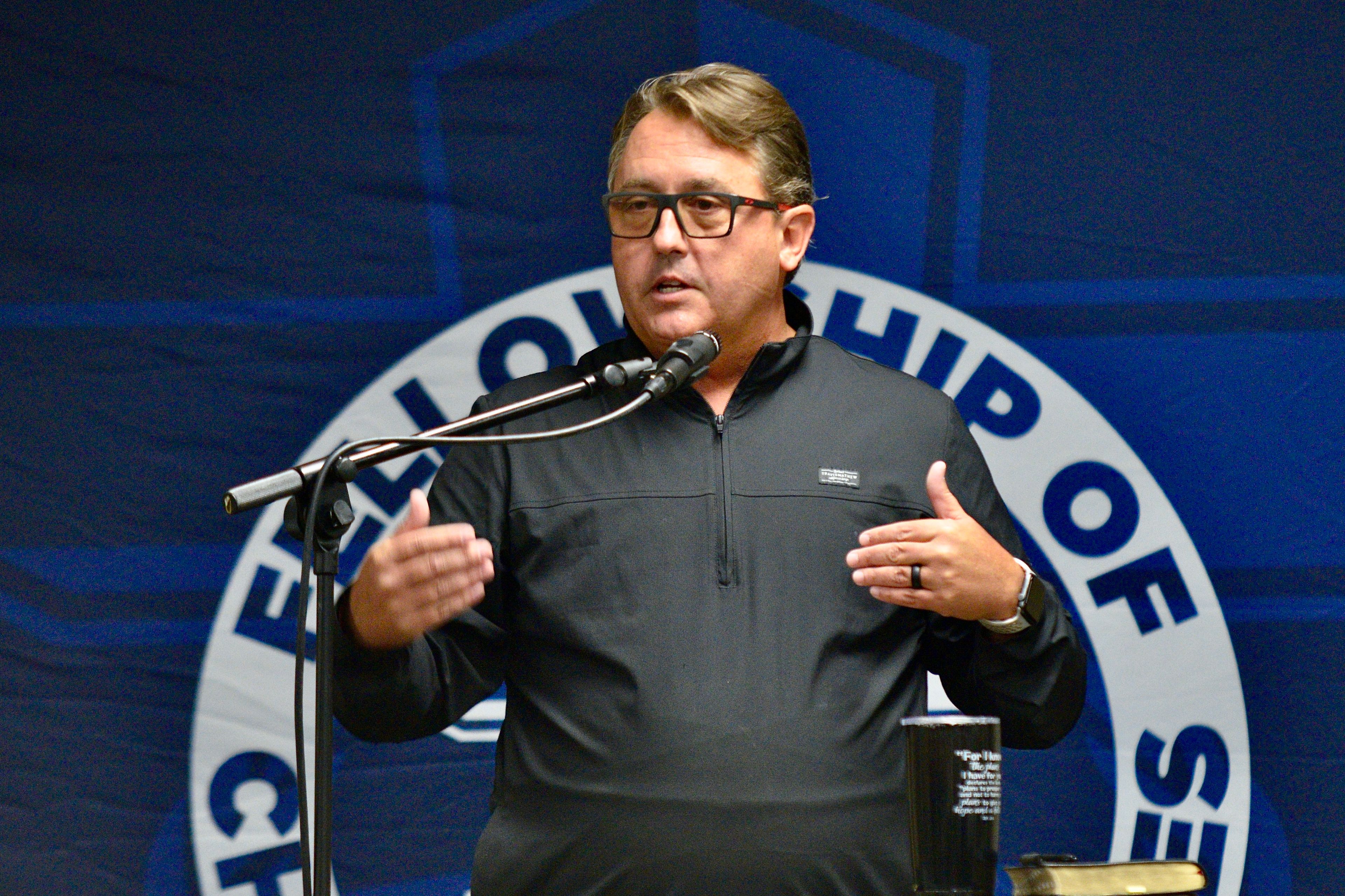 New Saxony Lutheran head coach Darrin Scott addresses the audience during the FCA Prayer Breakfast on Wednesday, Aug. 28, in Lynwood Baptist Church in Cape Girardeau.