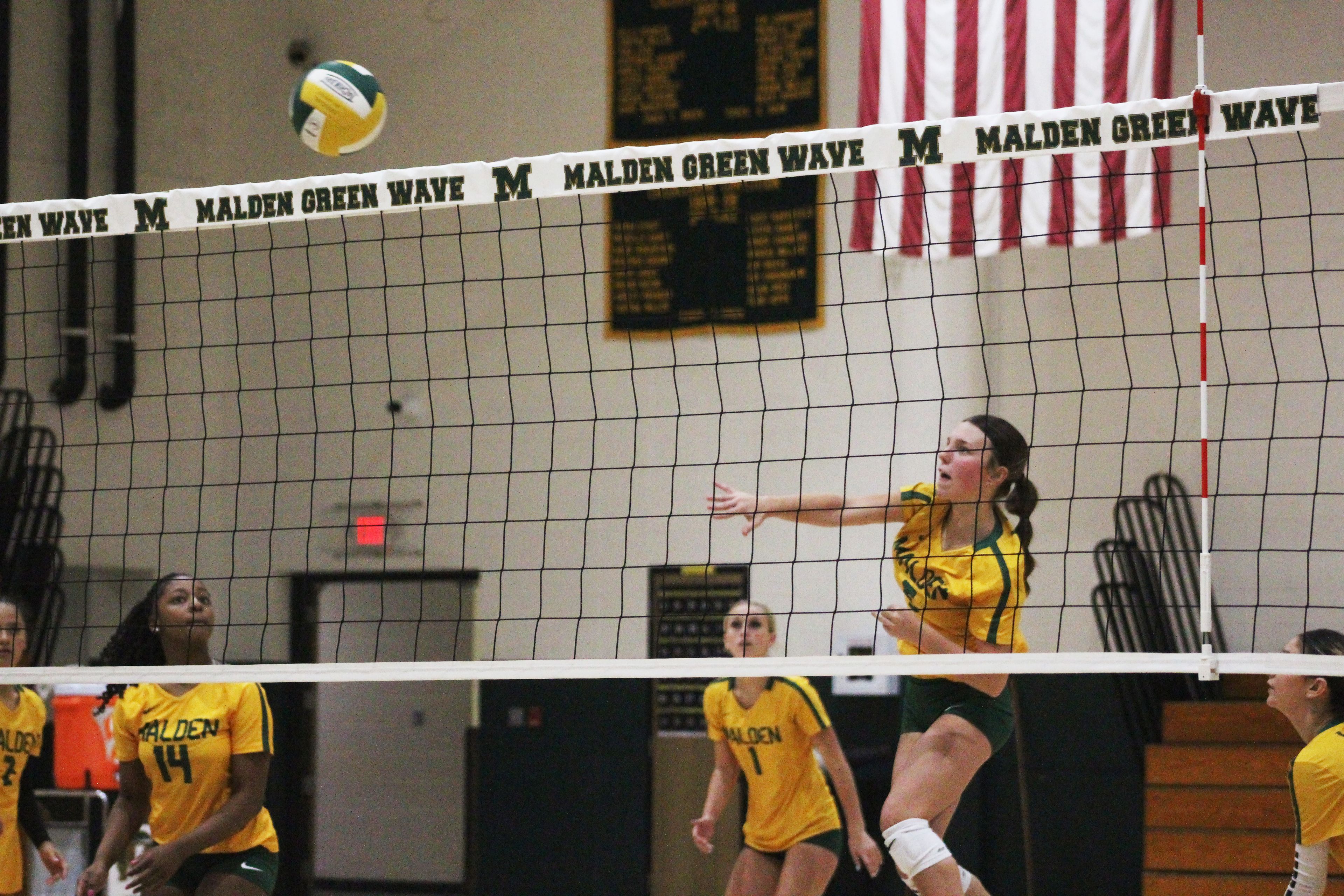 Carsyn Cohen swings and hits the ball for a kill.