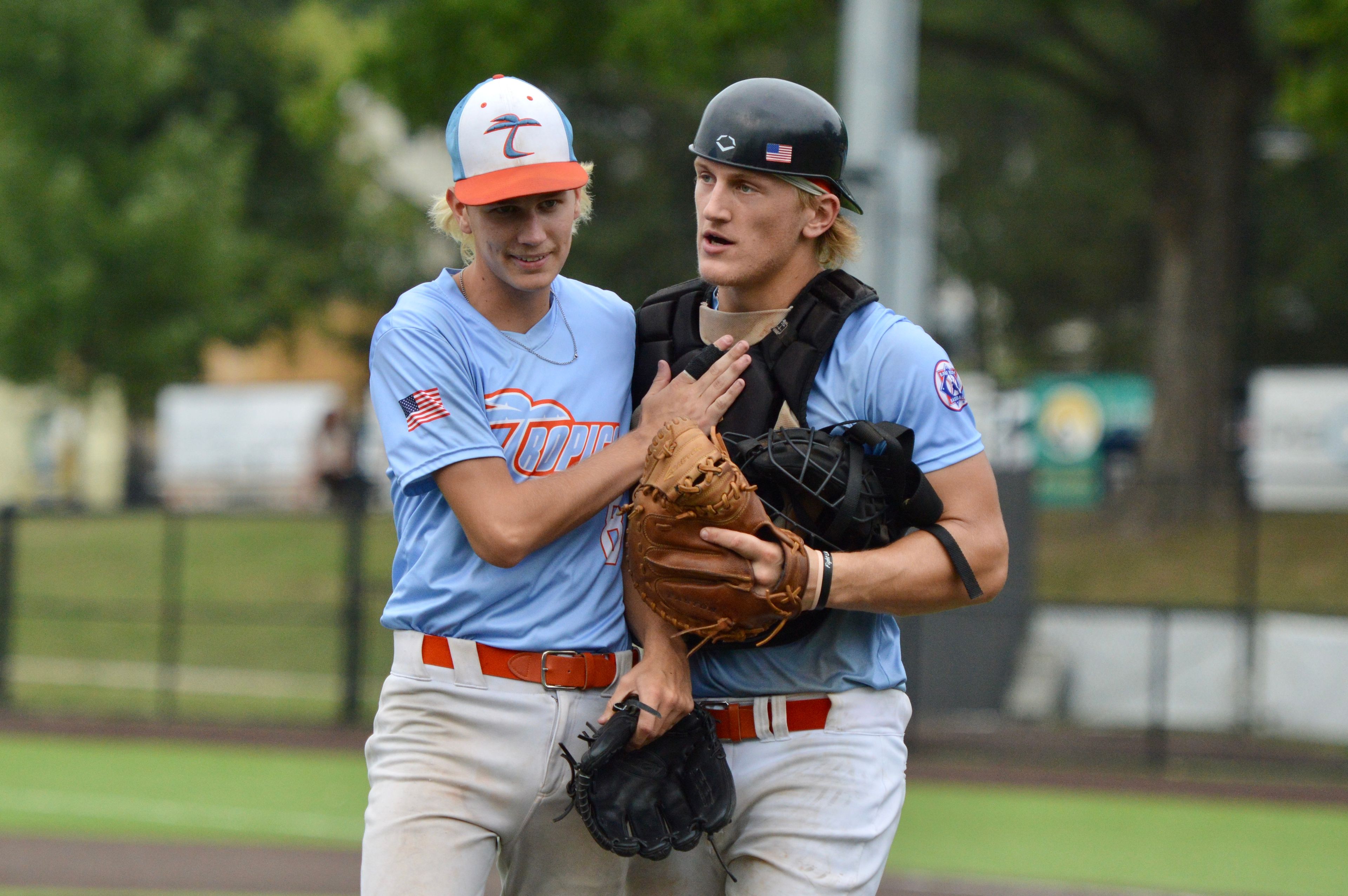 Southeast Tropics pitcher Ross Peters celebrates securing a win with catcher Trey Benthal after a 5-0 victory on Wednesday against Puerto Rico at Capaha Field.