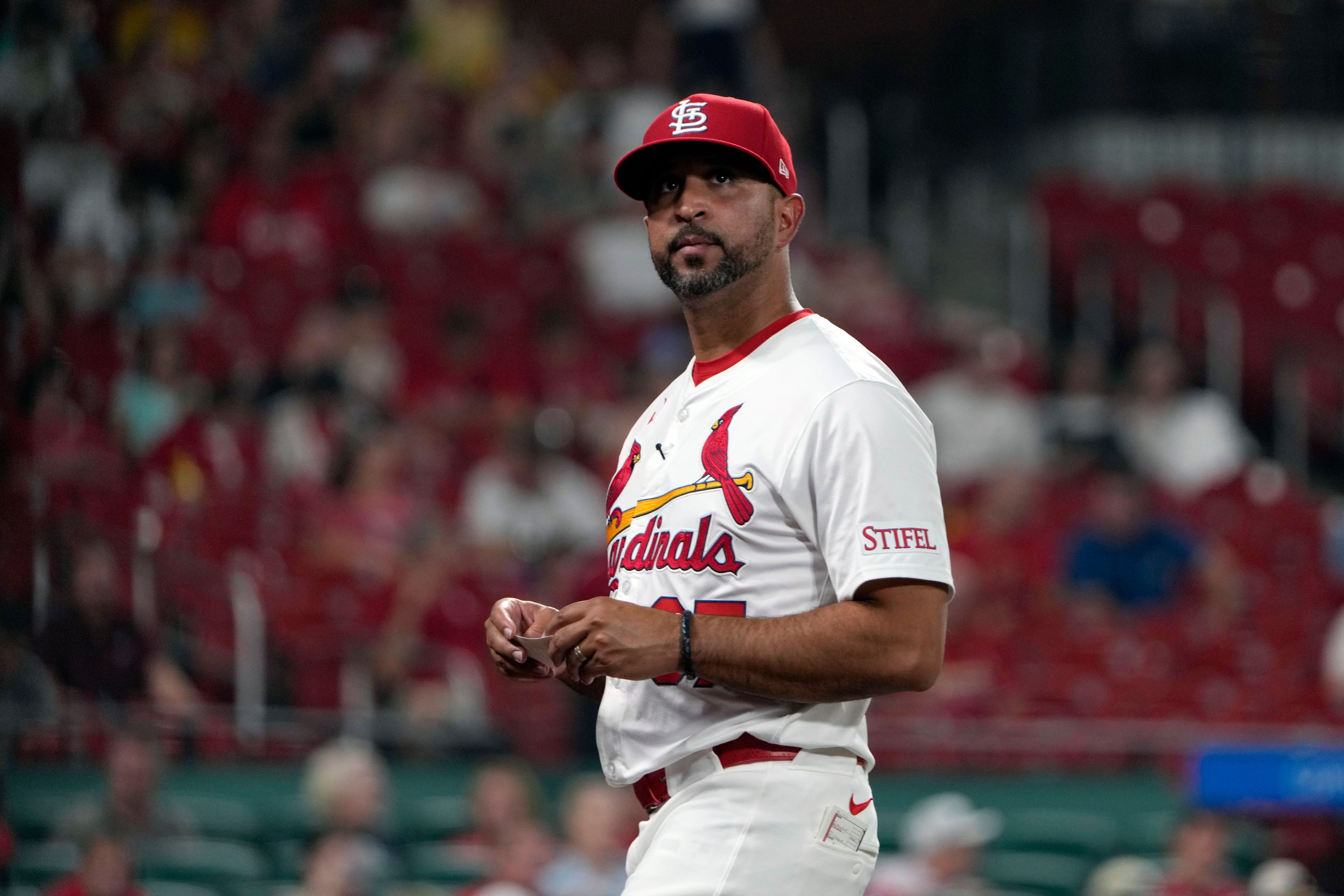 St. Louis Cardinals manager Oliver Marmol walks back from the mound after making a pitching change during the seventh inning of a baseball game against the San Diego Padres Tuesday, Aug. 27, 2024, in St. Louis. (AP Photo/Jeff Roberson)