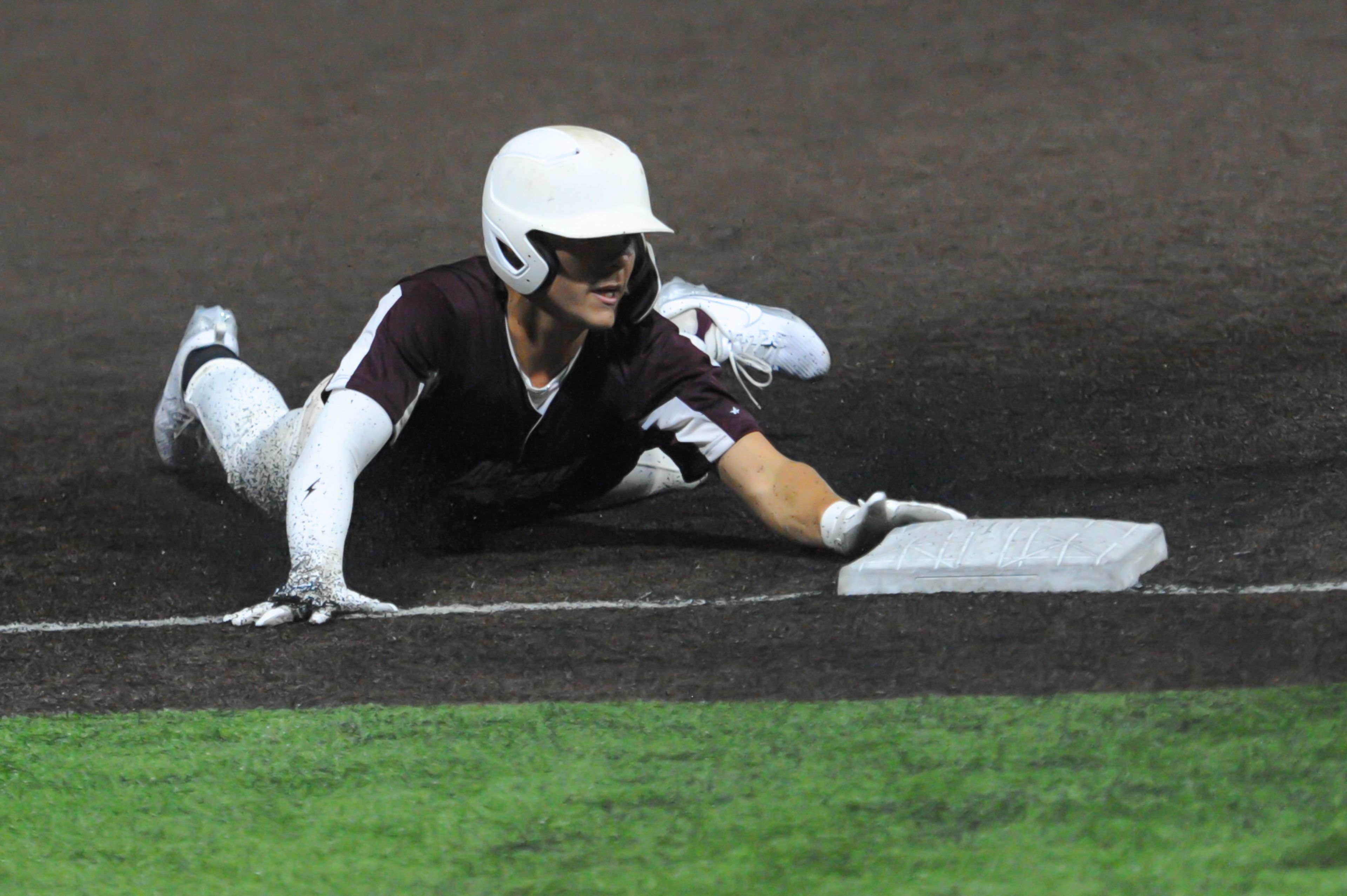 Altoona's Gavin Bell slides into third base on a triple during an August 14, 2024 Babe Ruth World Series game between the Aycorp Fighting Squirrels and the Altoona, Pennsylvania, at Capaha Field in Cape Girardeau, Mo. Aycorp defeated Altoona, 12-11.