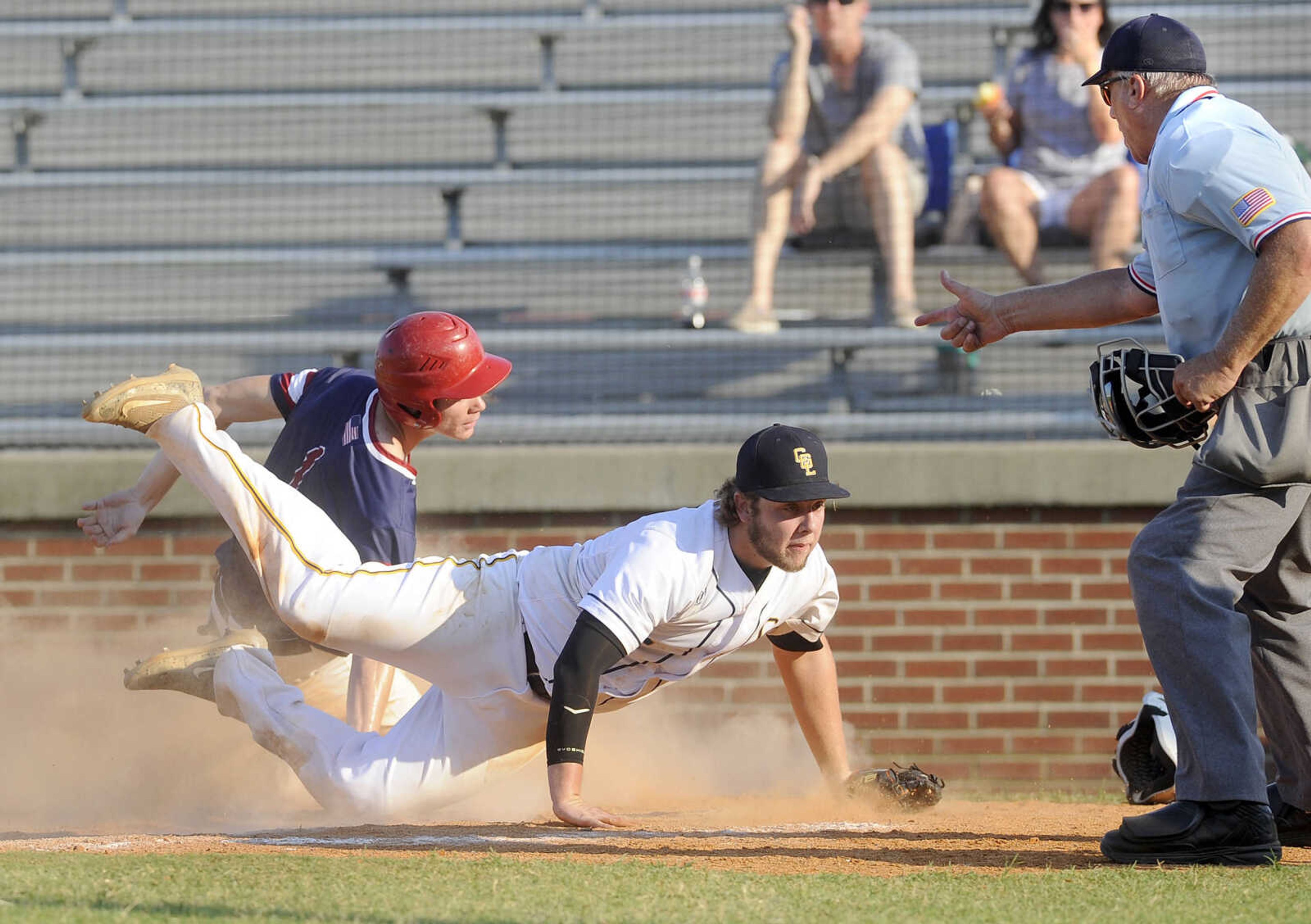 FRED LYNCH ~ flynch@semissourian.com
Cape Girardeau Post 63 reliever Trent Unterreiner covers the plate as Perryville Post 133's Seth Rousseau scores on a wild pitch during the fifth inning of a quarterfinal in the Senior Legion District Tournament Thursday, July 12, 2018 in Sikeston, Missouri.