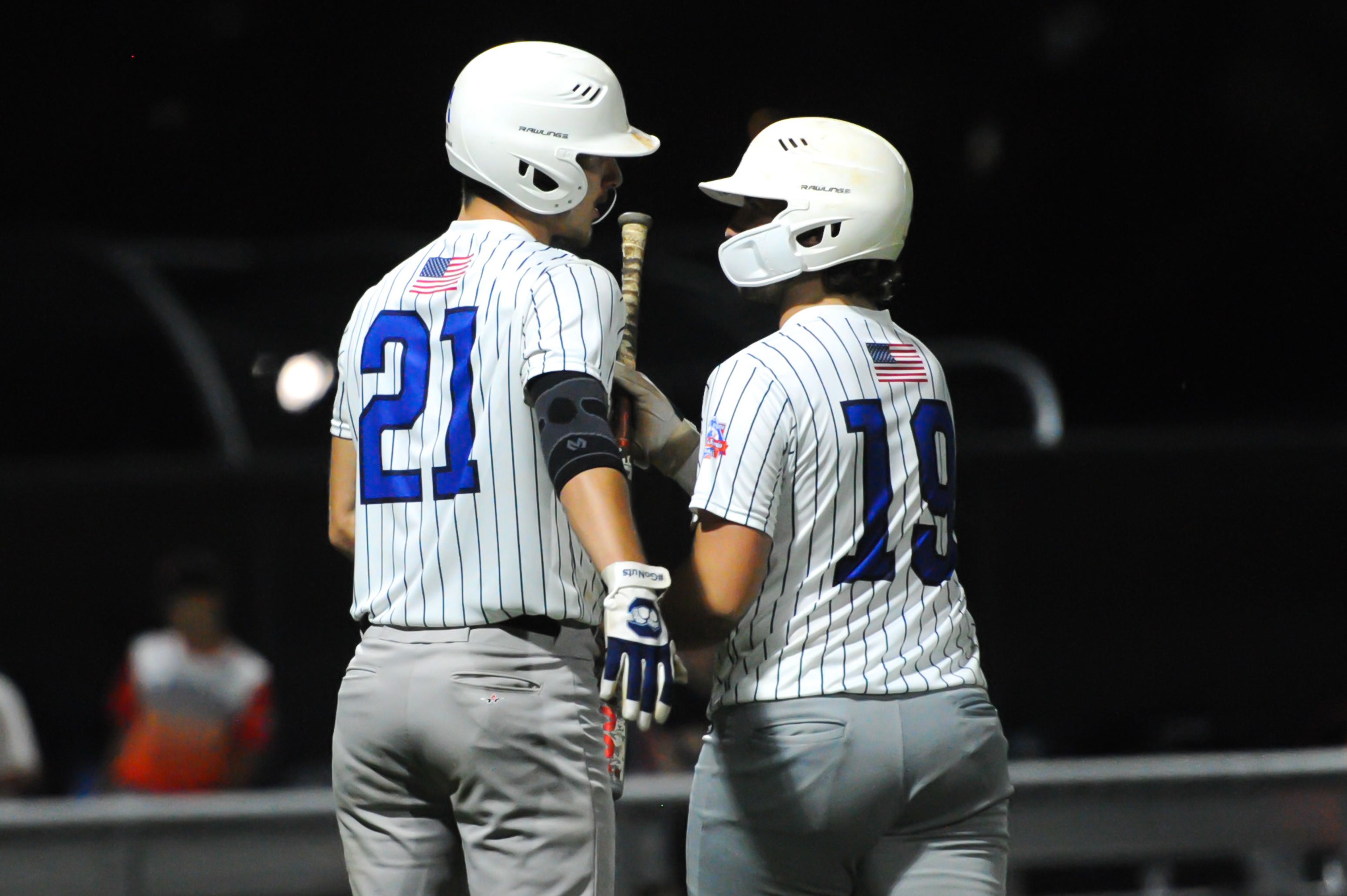 Aycorp's Levi McKinnie (left) greets Wyatt Friley (right) after Friley narrowly missed a homer foul during a Tuesday, August 13, 2024 Babe Ruth World Series game between the Aycorp Fighting Squirrels and Holland Henson of the Netherlands at Capaha Field in Cape Girardeau, Mo. Aycorp defeated the Netherlands, 12-2 in five innings.