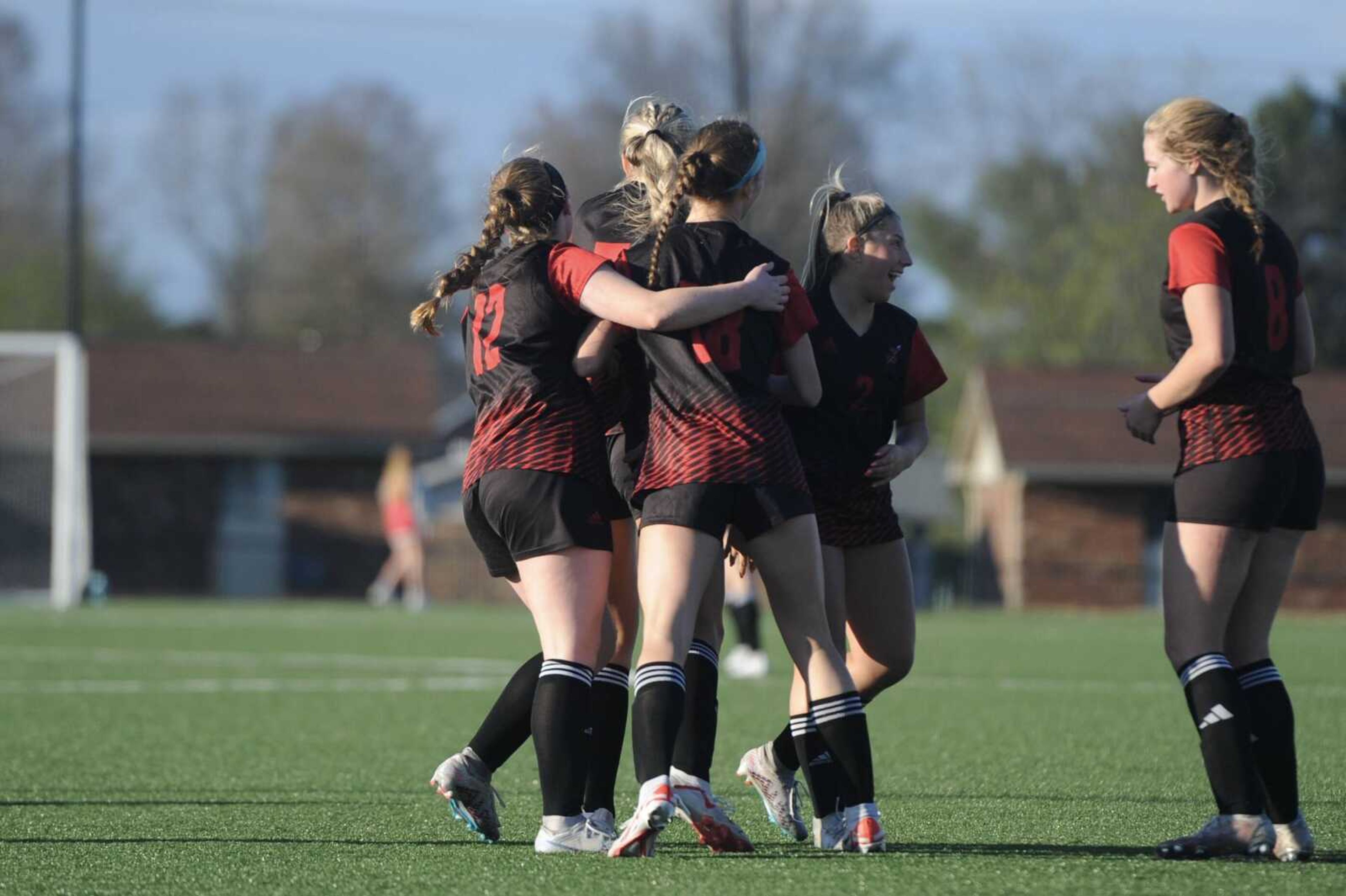 The Jackson girls' soccer team celebrates a goal scored during a March 26, 2024 game between the Jackson Indians and the Saxony Lutheran Crusaders at Jackson Junior High School in Jackson, Mo. Jackson defeated Saxony, 3-0.