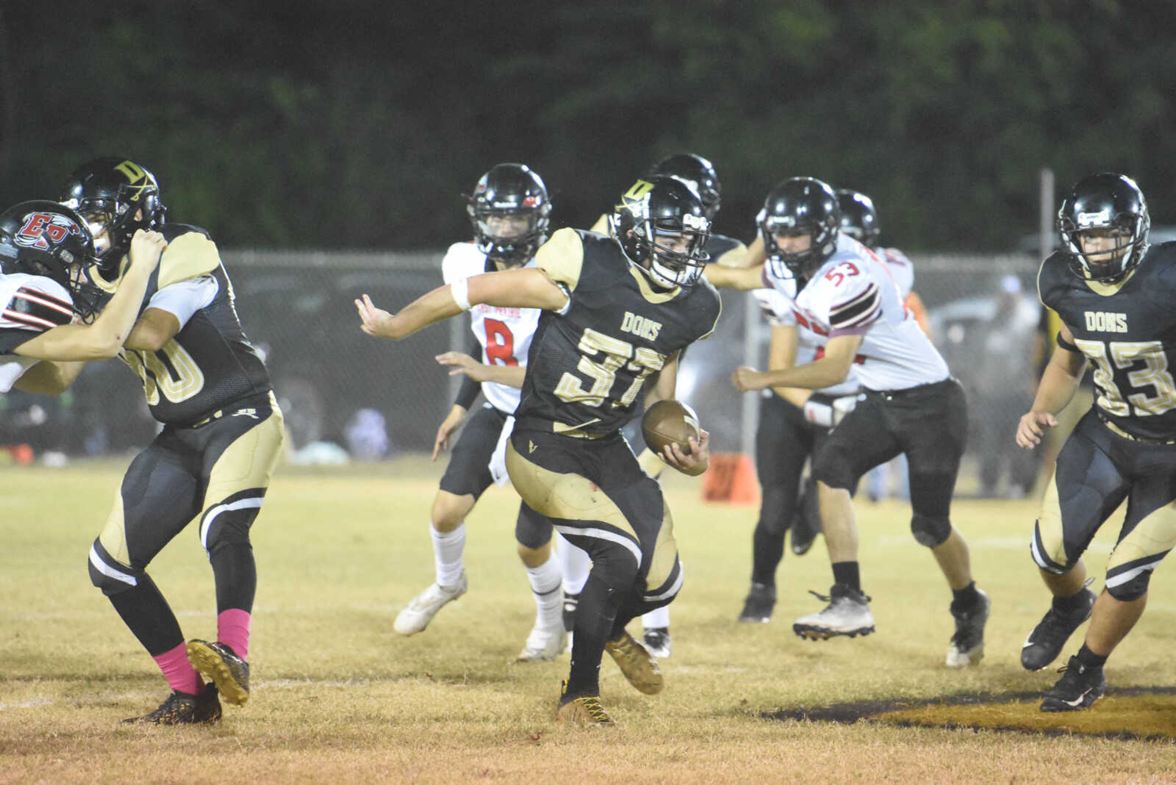 Doniphan's Luke Emmons runs through a hole in the East Prairie line on Friday, Oct. 7, 2022 in Doniphan.