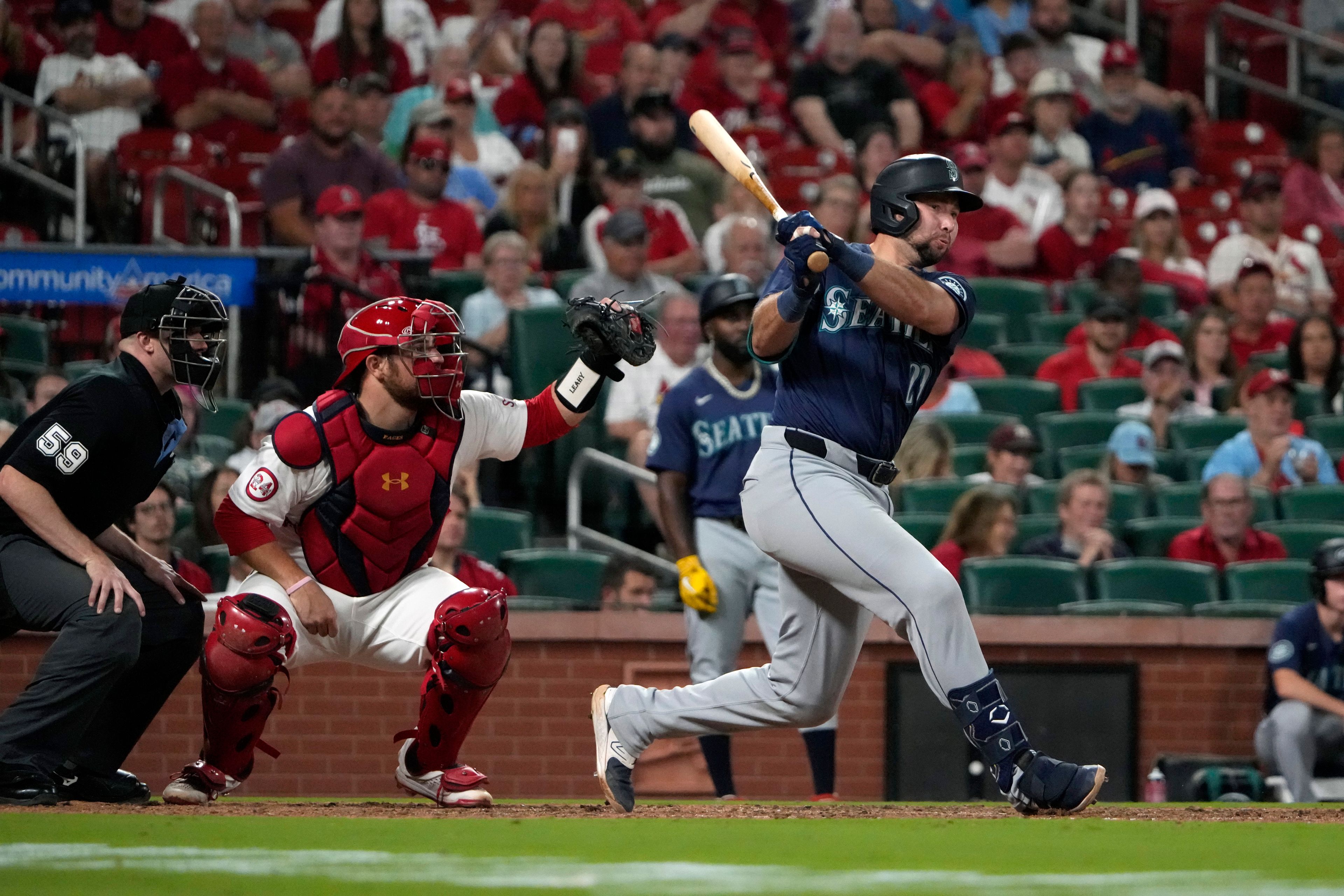 Seattle Mariners' Cal Raleigh follows through on a two-run double during the ninth inning of a baseball game against the St. Louis Cardinals Friday, Sept. 6, 2024, in St. Louis. (AP Photo/Jeff Roberson)