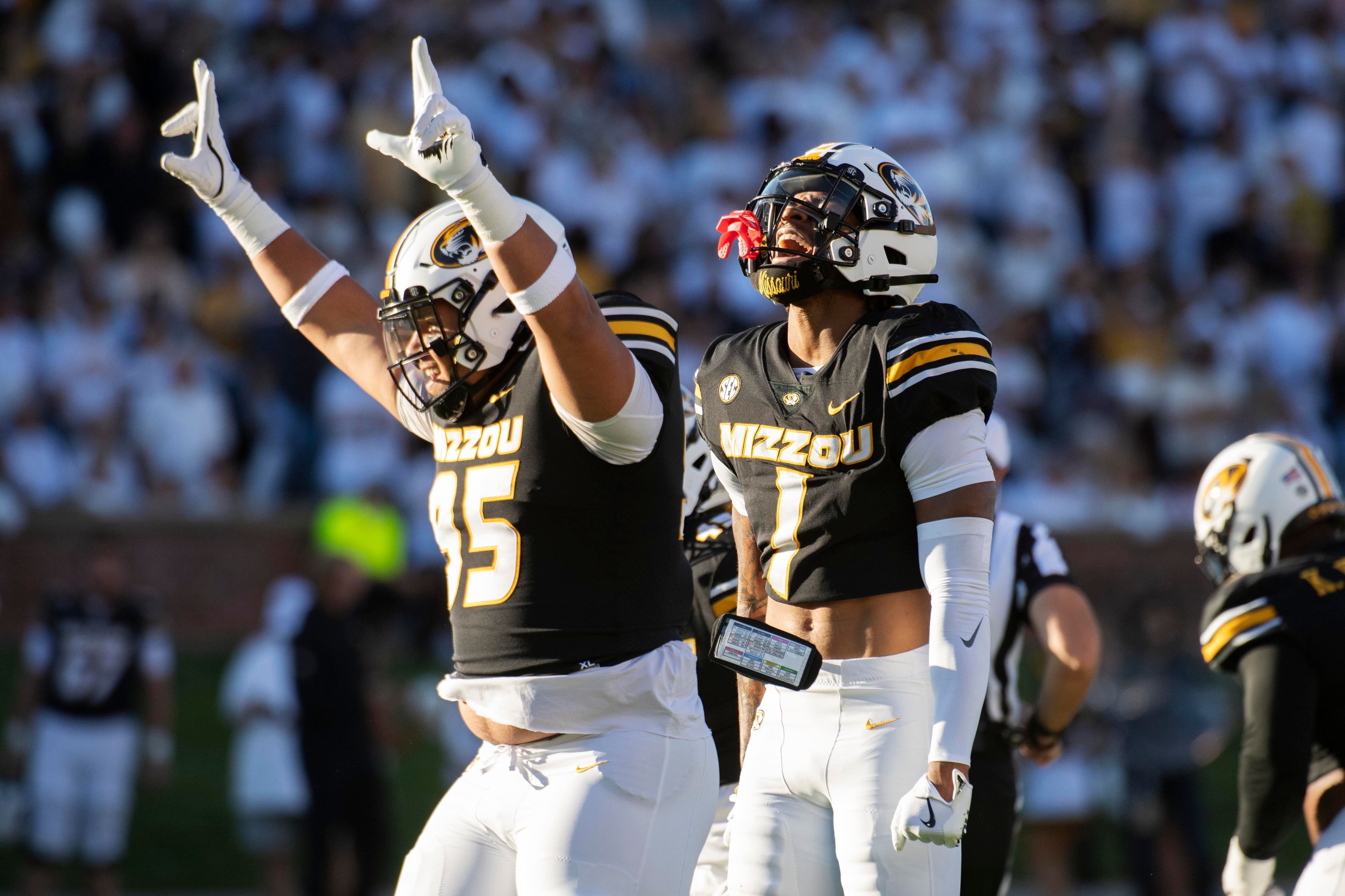 Missouri safety Marvin Burks Jr. (1) celebrates after his interception with teammate Jalen Marshall, left, during the first half of an NCAA college football game against Buffalo, Saturday, Sept. 7, 2024, in Columbia, Mo. (AP Photo/L.G. Patterson)