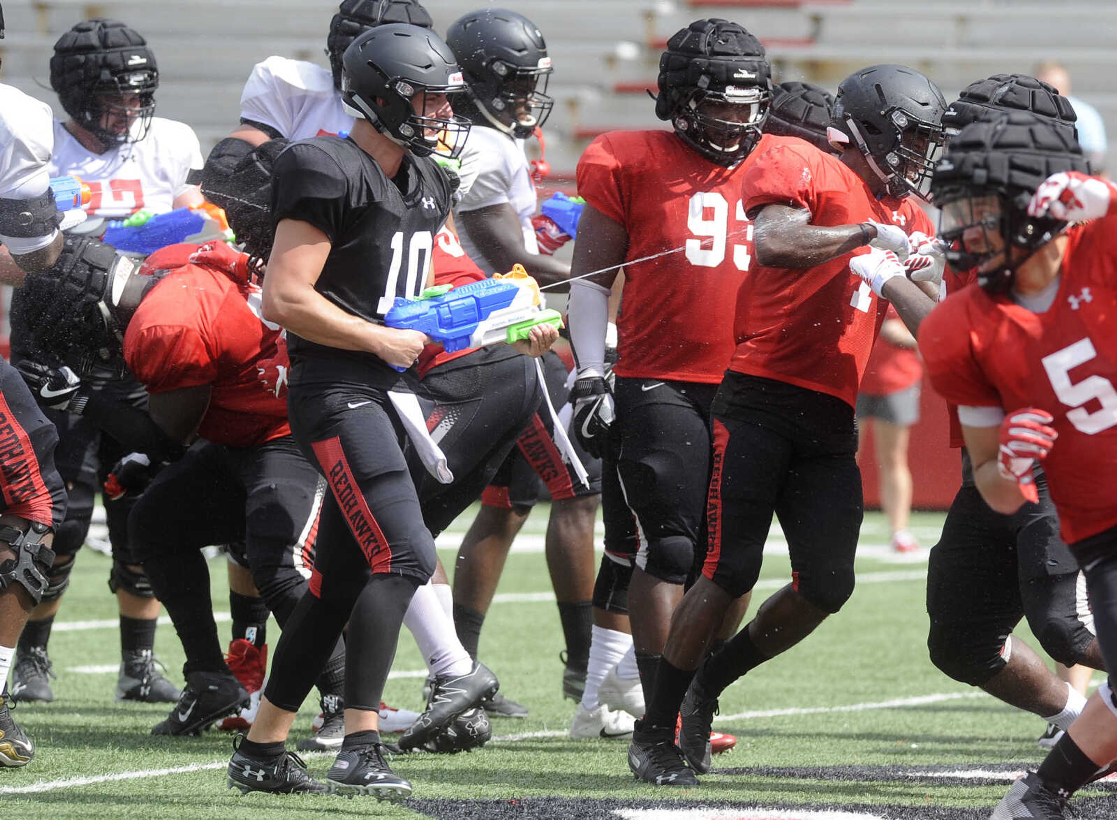 FRED LYNCH ~ flynch@semissourian.com
Southeast Missouri State quarterback Daniel Santacaterina joins the fun with a water gun at the close of the last preseason scrimmage Saturday, Aug. 18, 2018 at Houck Field.