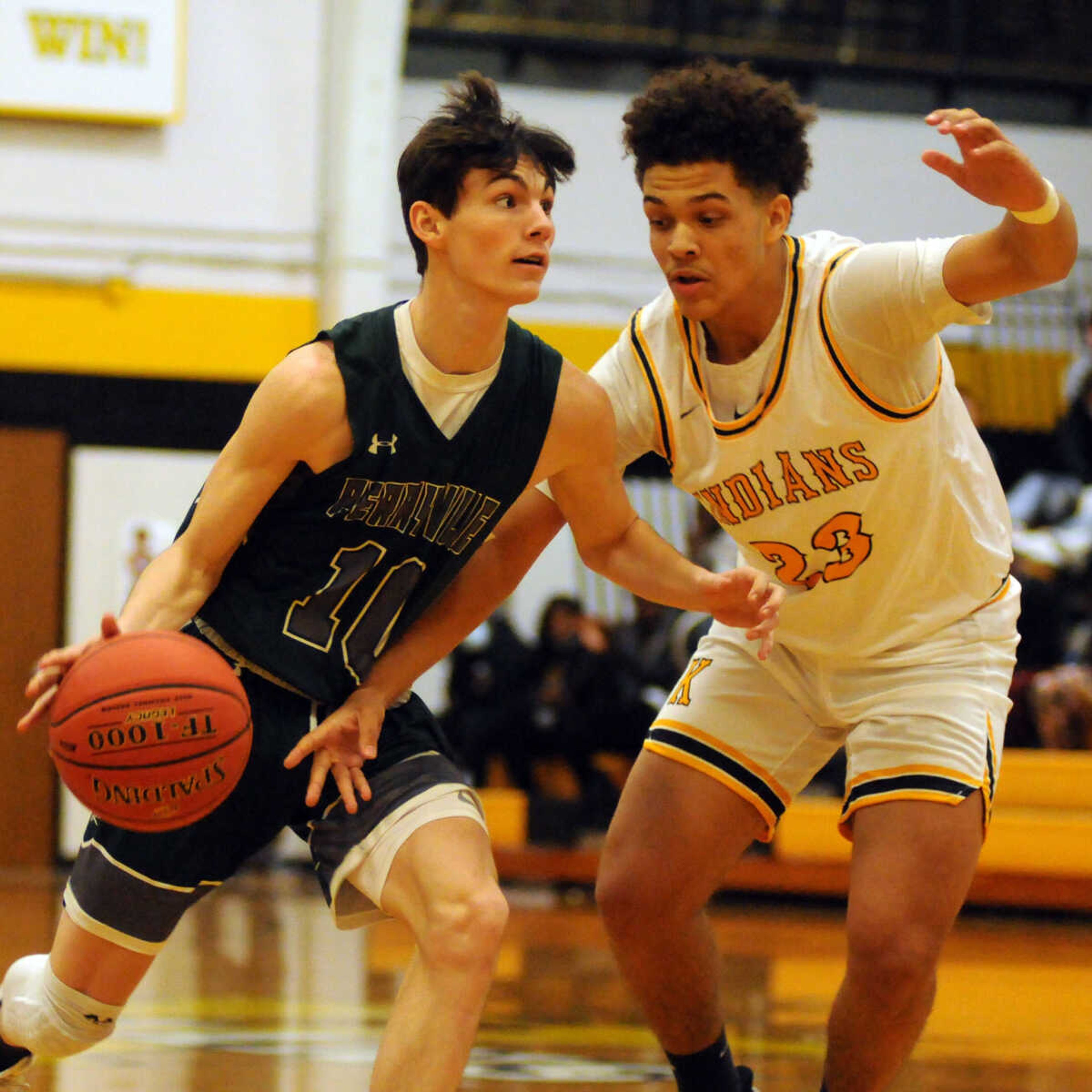 Perryville's Treyton Scruggs is guarded by Kennett's Elijah Jackson in a varsity boys basketball game last season at Kennett High School. 