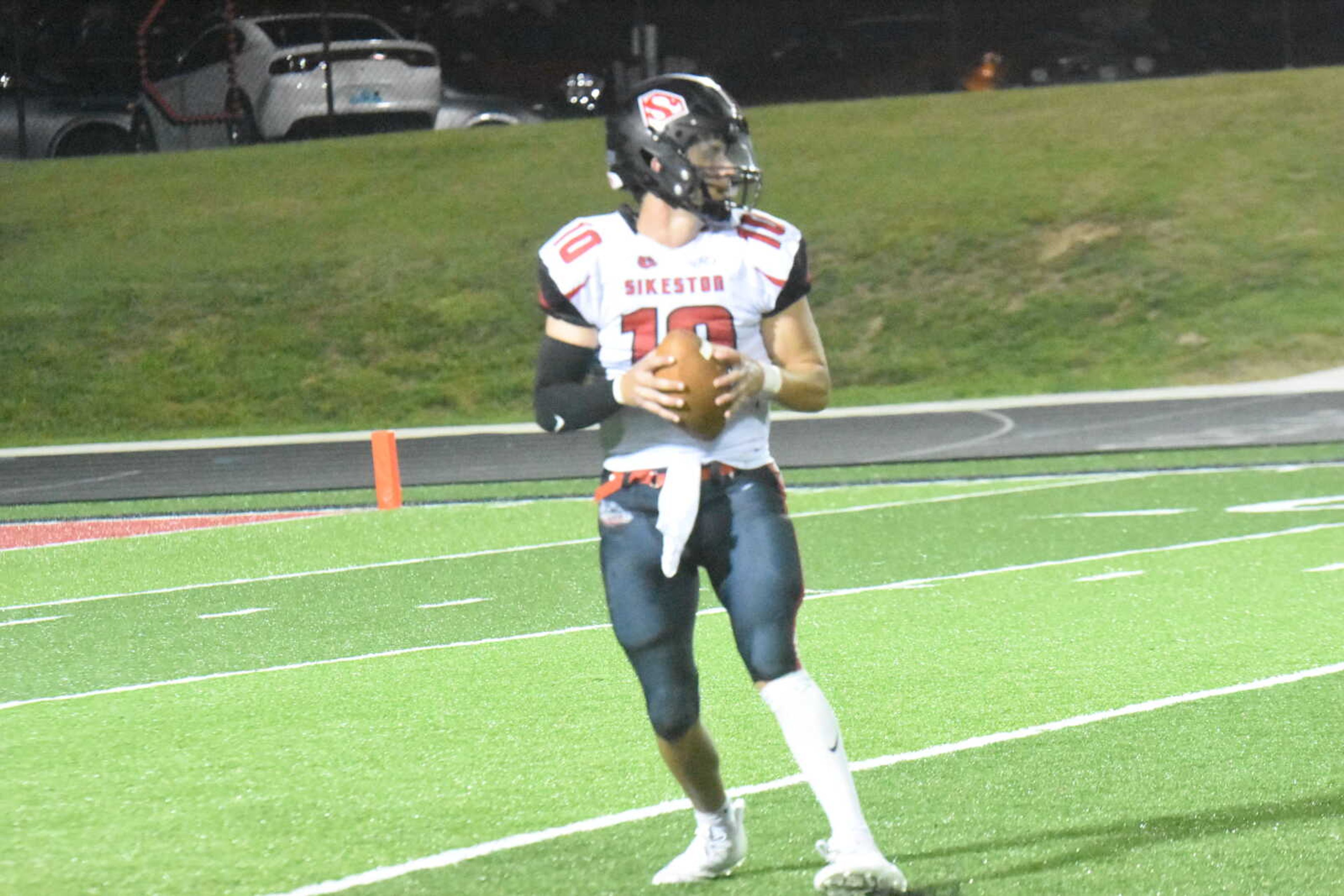 Sikeston quarterback Joseph Heckemeyer (10) looks downfield for a receiver.