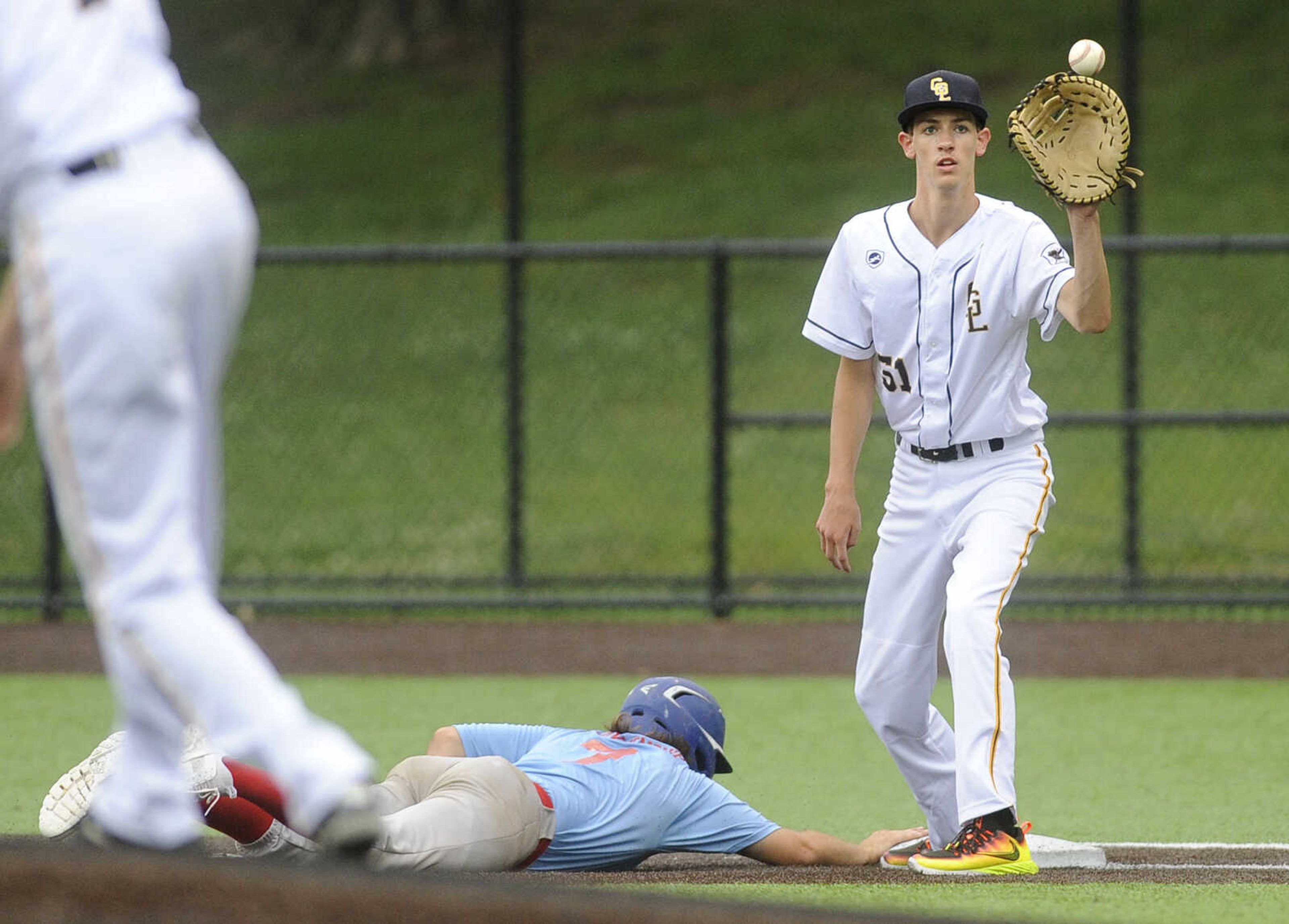 FRED LYNCH ~ flynch@semissourian.com
Cape Girardeau Post 63 Senior Legion first baseman Bryan McNeely catches a pickoff throw as Pemiscot County's Logan Blankenship gets back safely during the third inning Tuesday, June 12, 2018 at Capaha Field.