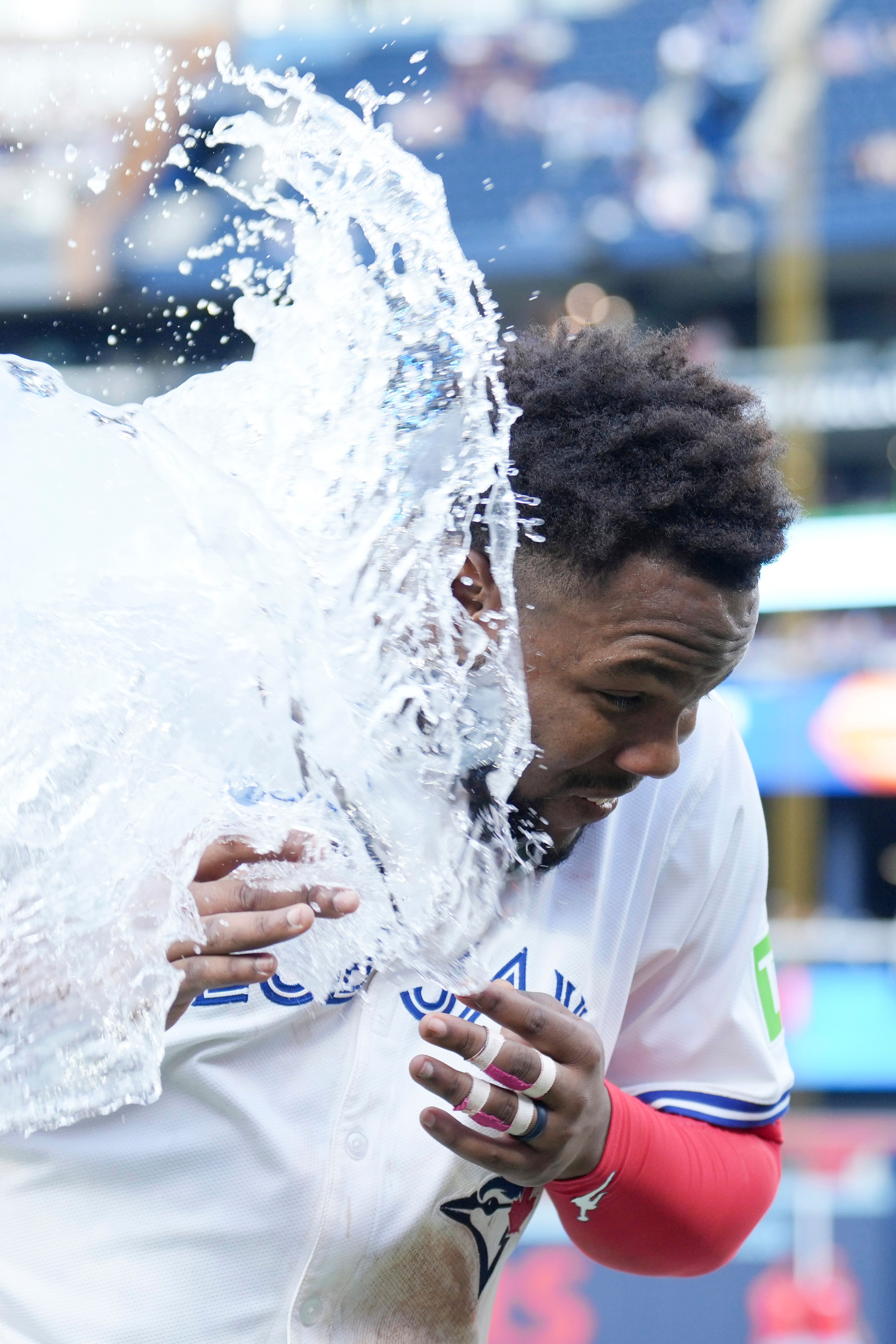 Toronto Blue Jays' Vladimir Guerrero Jr. is doused after defeating the St. Louis Cardinals in interleague MLB baseball action in Toronto, Saturday, September 14, 2024. (Chris Young/The Canadian Press via AP)