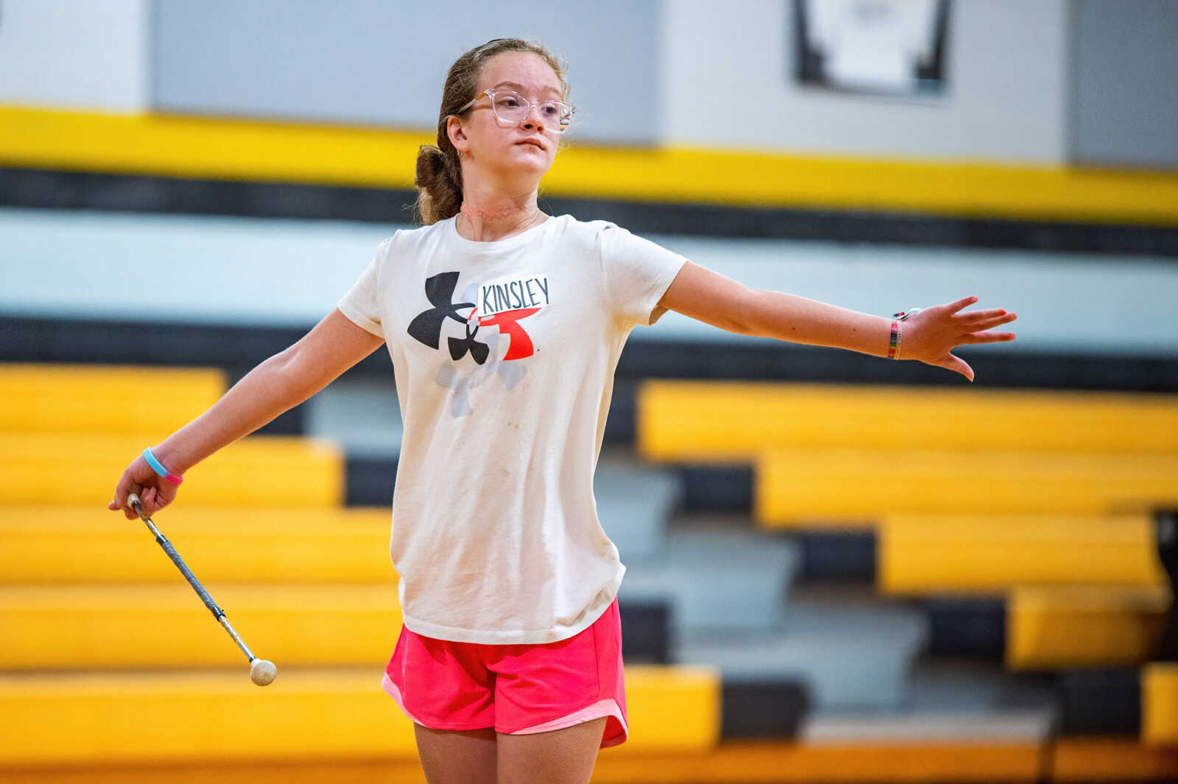 Band Auxiliary Clinic participants learn twirling and flags routines by members of the Kennett High School and Middle School twirling and color guard teams, Wednesday, July 20, 2022.