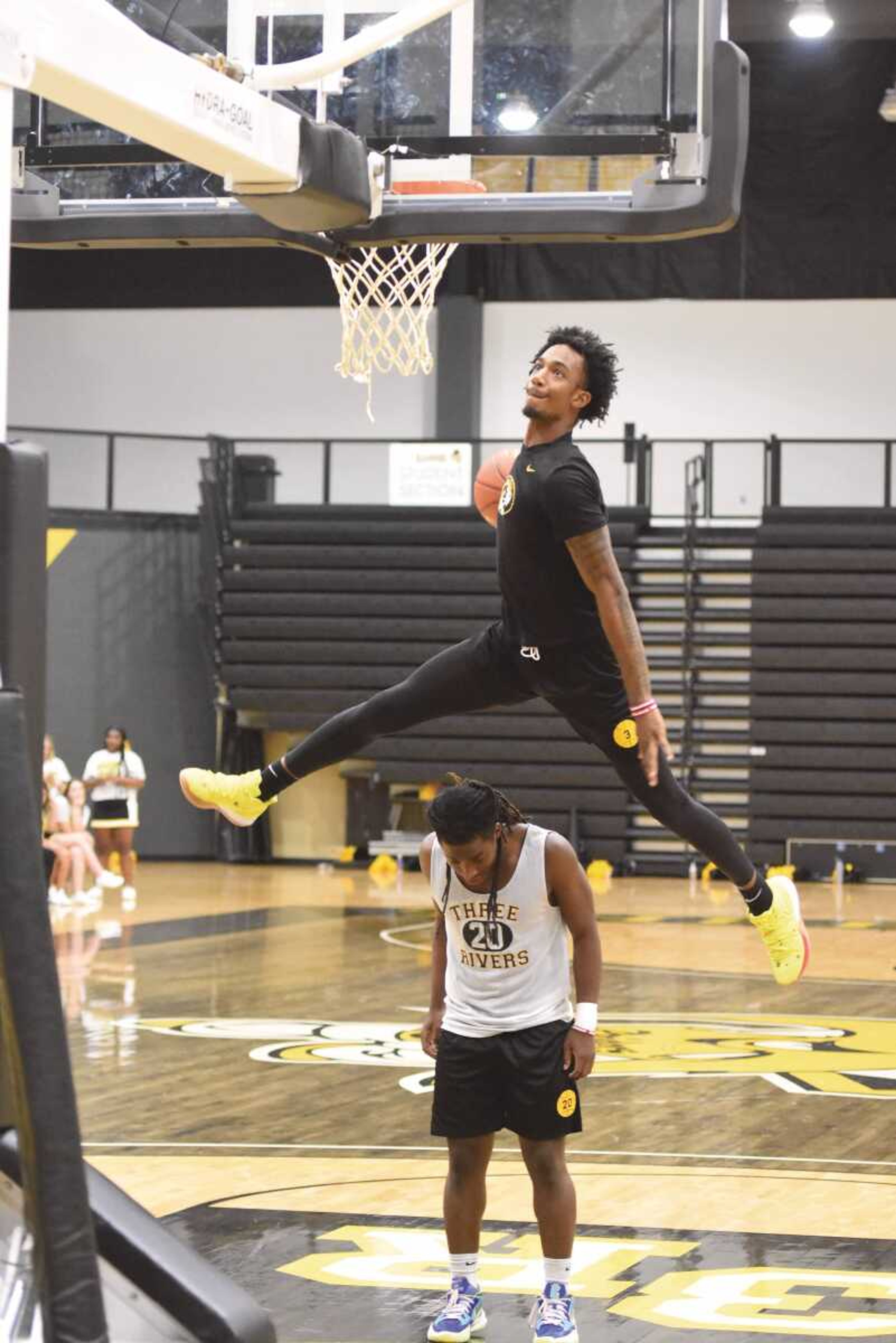 Three Rivers' Caleb Young jumps over Darian Webb during the dunk contest in Raider Madness on Saturday, Sept. 30, 2022 at the Libla Family Sports Complex in Poplar Bluff, Mo.