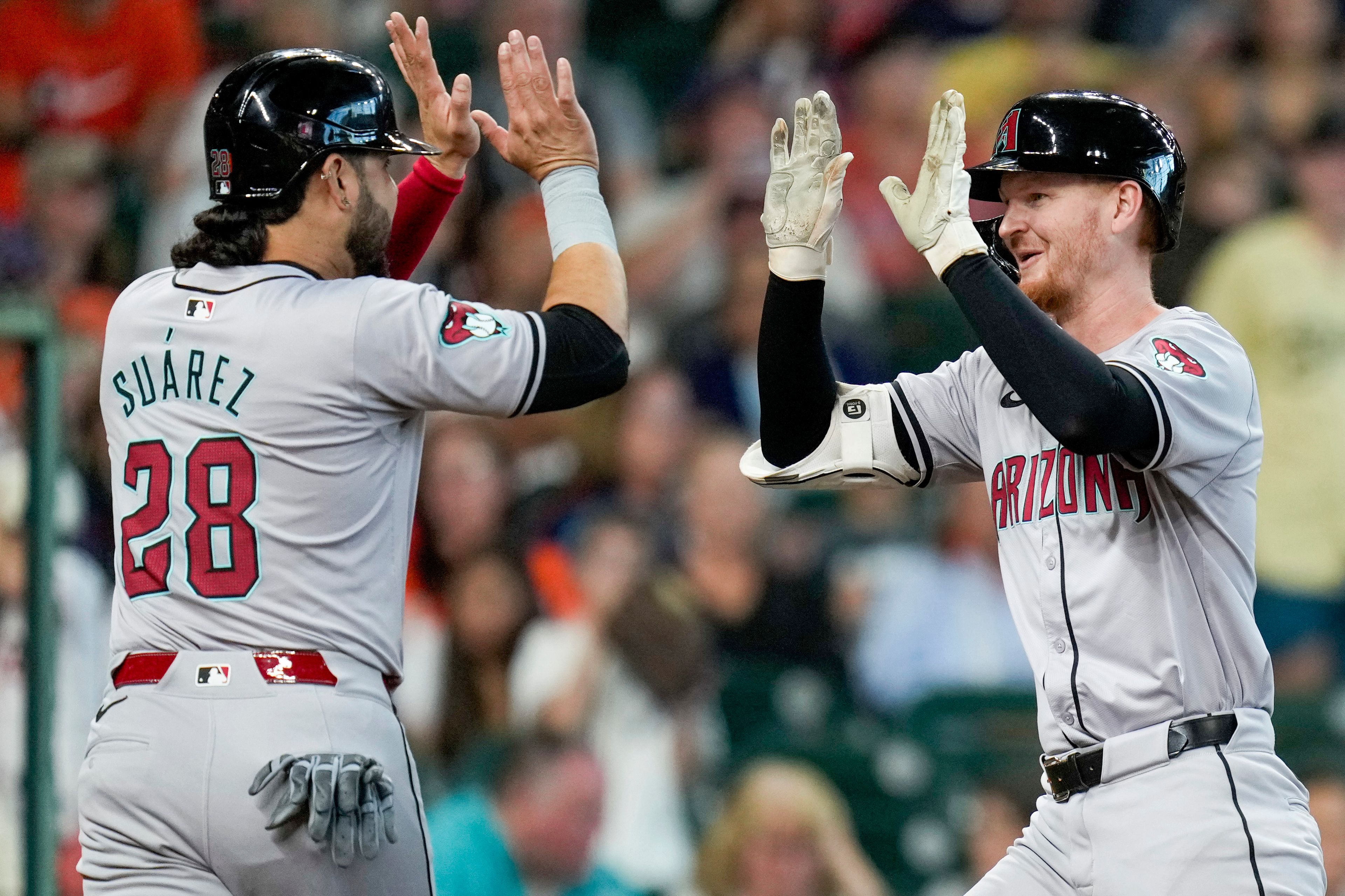 Arizona Diamondbacks' Pavin Smith, right, celebrates after his three-run home run against the Houston Astros with Eugenio Suarez during the second inning of a baseball game Sunday, Sept. 8, 2024, in Houston. (AP Photo/Eric Christian Smith)