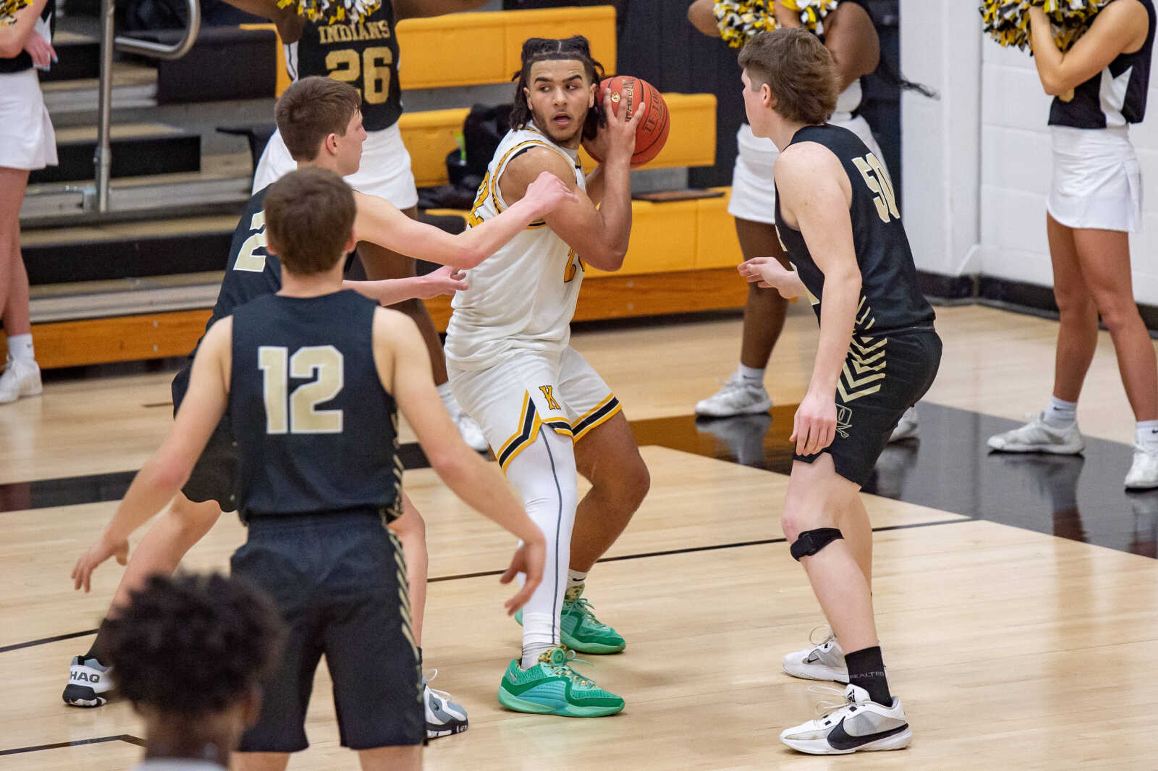 Kennett's Chris Jefferson (22) gets blocked out by Doniphan defenders Thursday, Feb. 22.