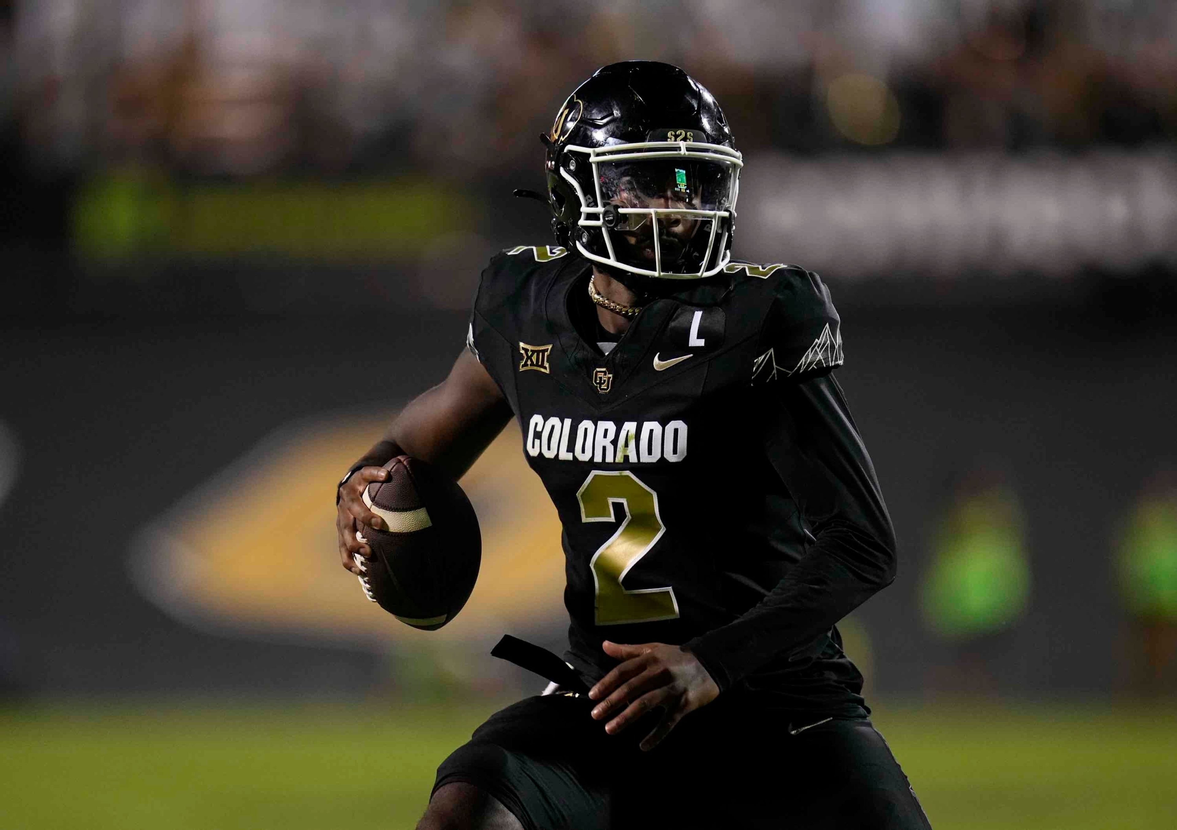 Colorado quarterback Shedeur Sanders scrambles during the second half of an NCAA college football game against North Dakota State Thursday, Aug. 29, 2024, in Boulder, Colo. (AP Photo/Jack Dempsey)