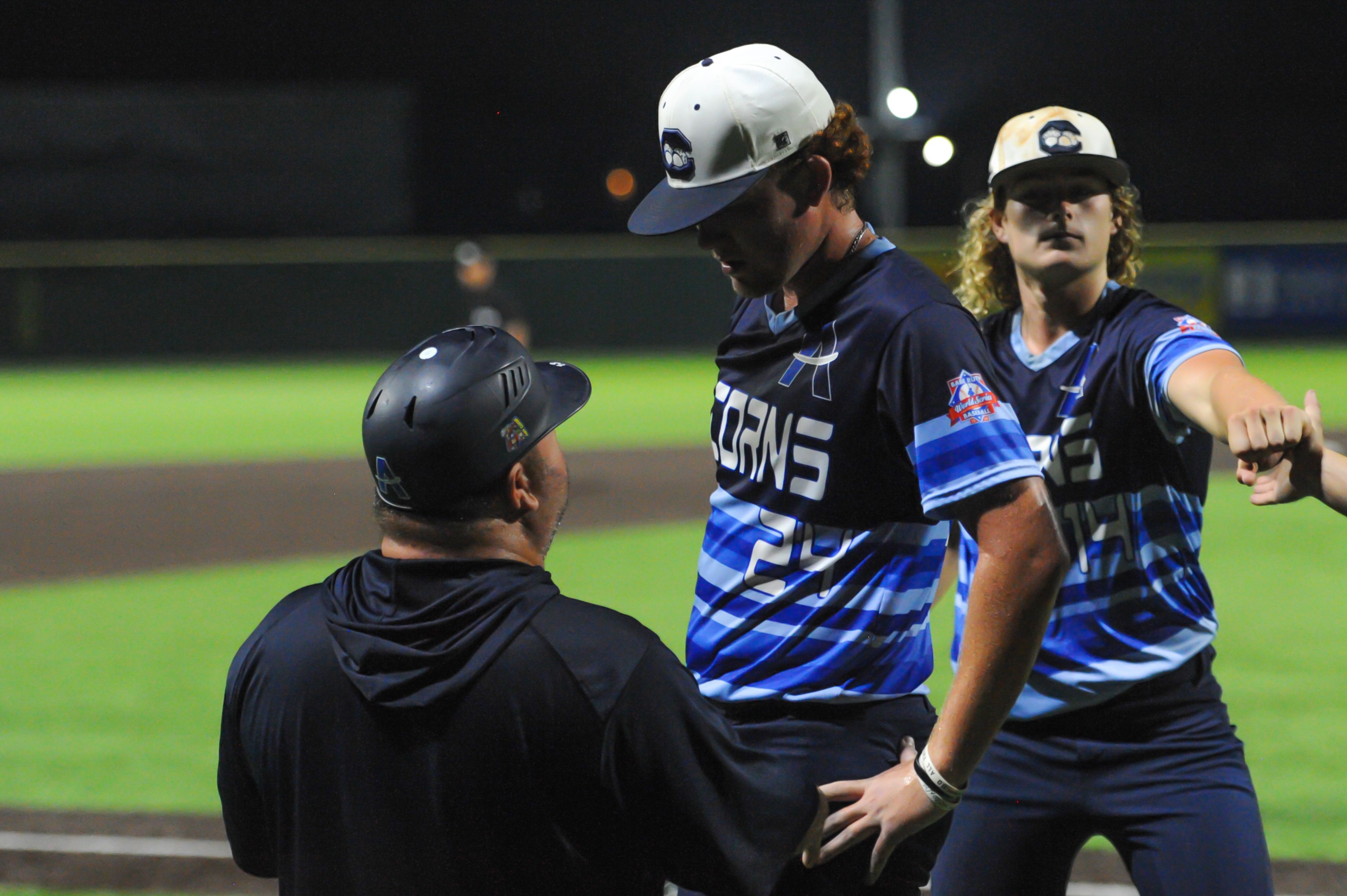 Aycorp coach Michael Minner talks to pitcher Luke Hester during an August 14, 2024 Babe Ruth World Series game between the Aycorp Fighting Squirrels and the Altoona, Pennsylvania, at Capaha Field in Cape Girardeau, Mo. Aycorp defeated Altoona, 12-11.