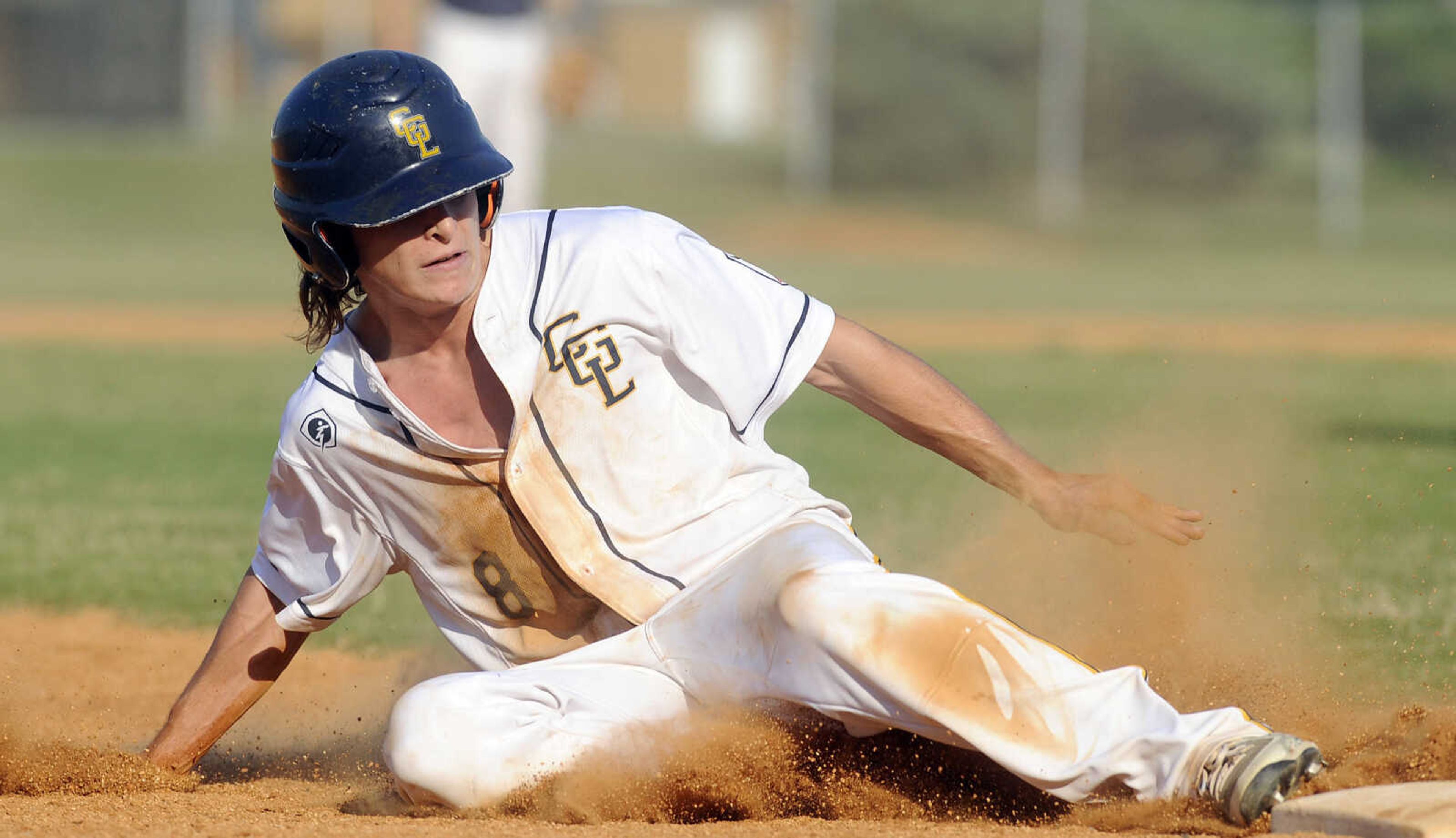 FRED LYNCH ~ flynch@semissourian.com
Cape Girardeau Post 63's Ben Womack slides safely into third base against Perryville Post 133 during the fourth inning of a quarterfinal in the Senior Legion District Tournament Thursday, July 12, 2018 in Sikeston, Missouri.