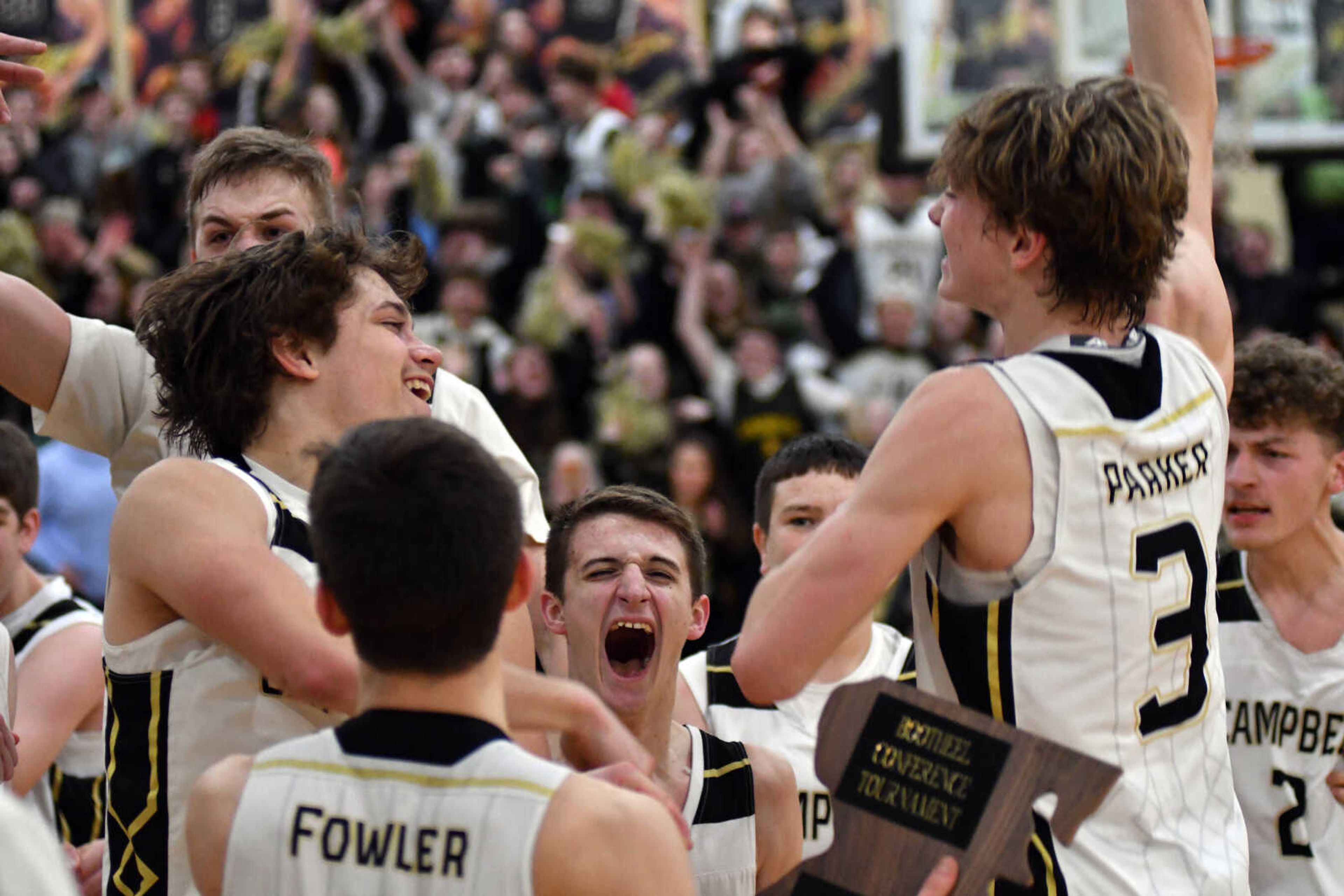 The Campbell boy's basketball squad celebrates winning the 2021 Bootheel Conference Tournament last season at Campbell.