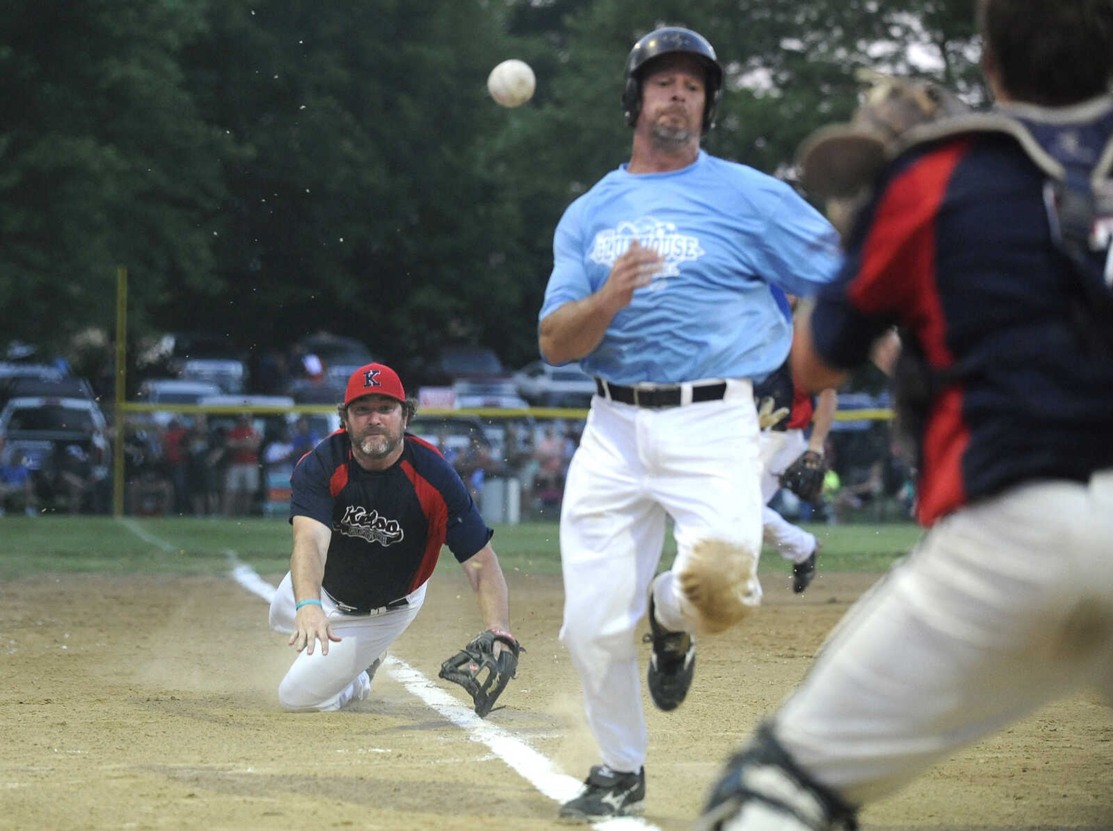 FRED LYNCH ~ flynch@semissourian.com
Kelso Fast Pitch third baseman David Headley throws the ball to catcher Justin Landewee who tagged out The Clubhouse's Doug Bryan at the plate during the second inning Friday, June 8, 2018 at the Kelso Klassic in Kelso, Missouri.