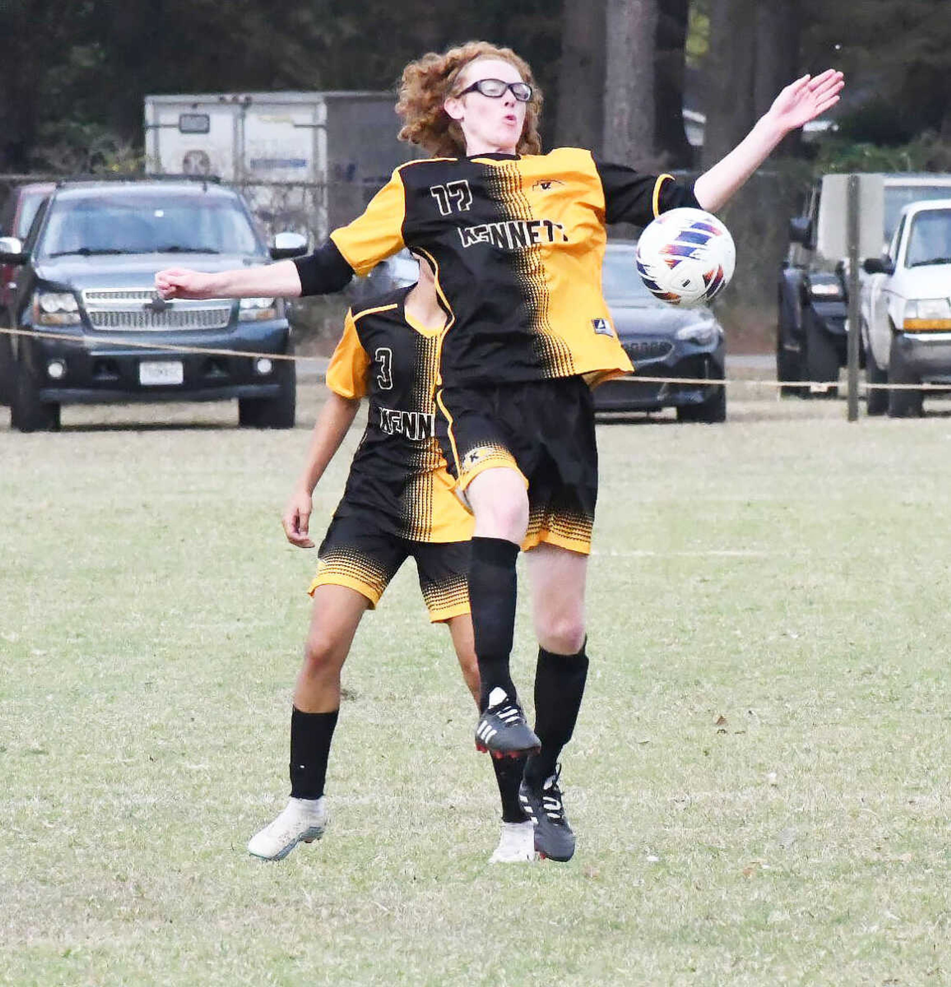 Kennett High School’s Tobias Ray (17) attempts to play the ball off his chest during Tuesday’s soccer match versus Saxony Lutheran at Indian Park.