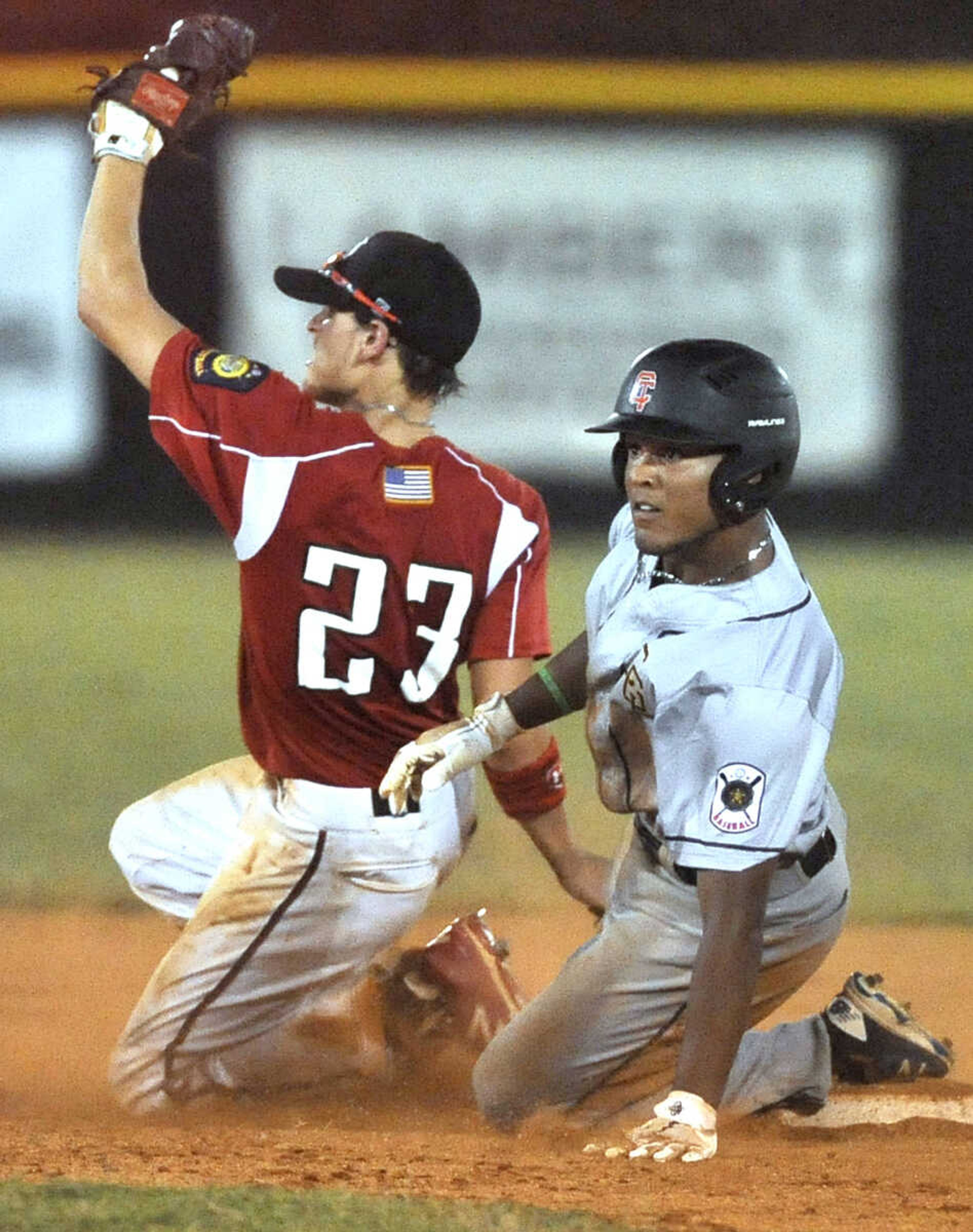 FRED LYNCH ~ flynch@semissourian.com
Cape Girardeau Post 63's Joseph Baker beats Jackson Post 158 second baseman Justice Crosnoe to the bag during the sixth inning of a semifinal in the Senior Legion District Tournament Friday, July 13, 2018 in Sikeston, Missouri.