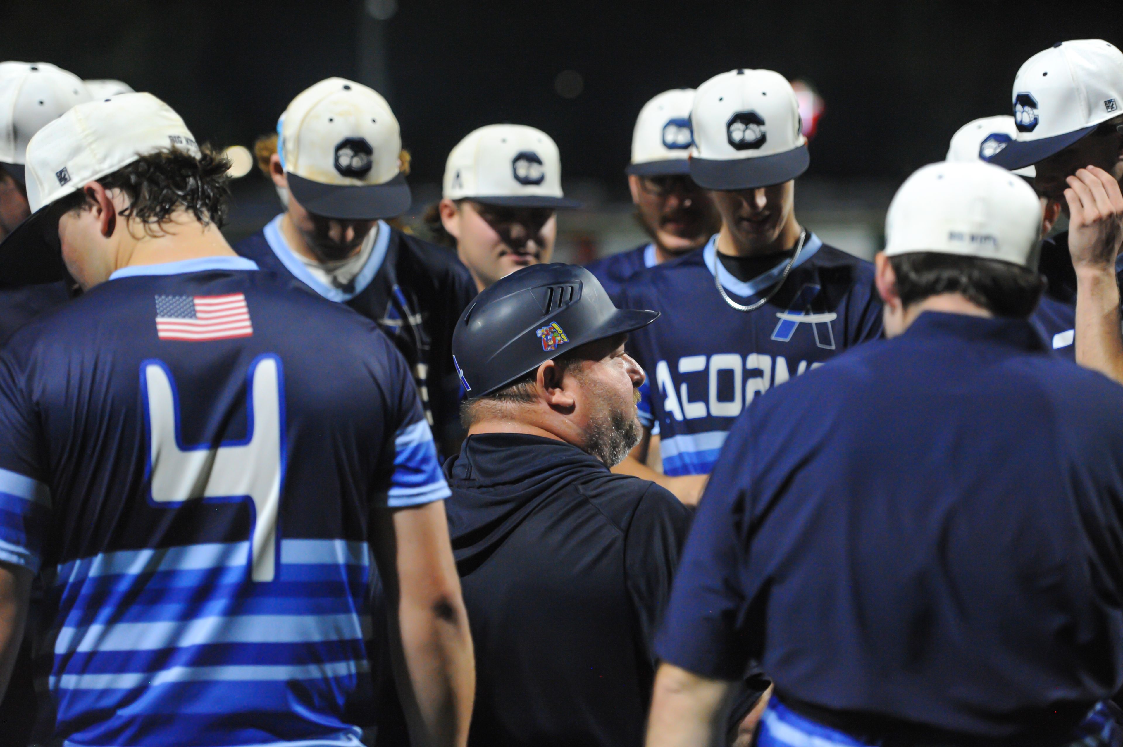 Aycorp coach Michael Minner (center) talks to his players after an August 14, 2024 Babe Ruth World Series game between the Aycorp Fighting Squirrels and the Altoona, Pennsylvania, at Capaha Field in Cape Girardeau, Mo. Aycorp defeated Altoona, 12-11.