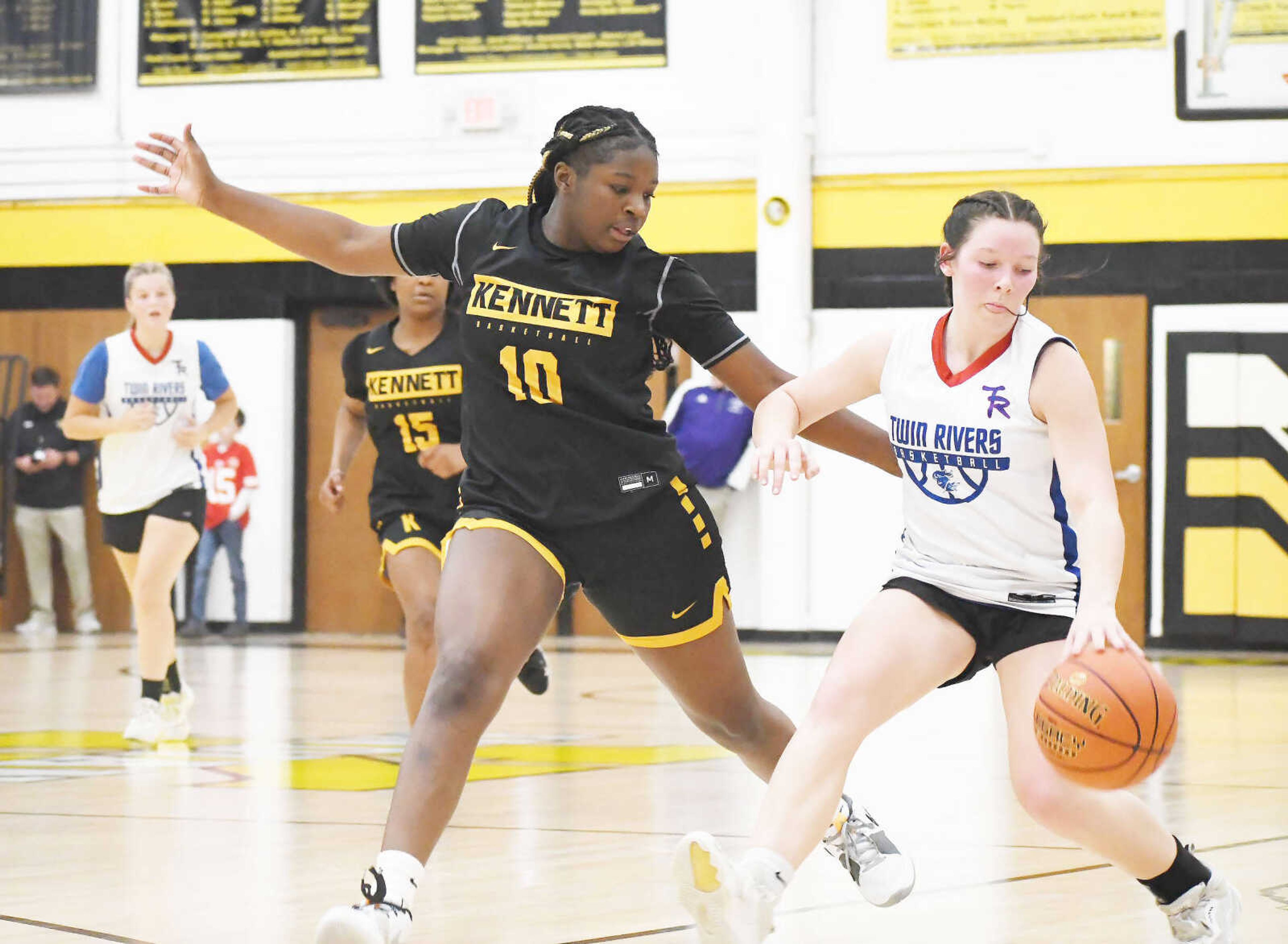 Kennett’s Tayja Carter (10) applies stout defense on a Twin Rivers player during a girls' basketball jamboree at Kennett High School dated Thursday, Nov. 16, 2023.