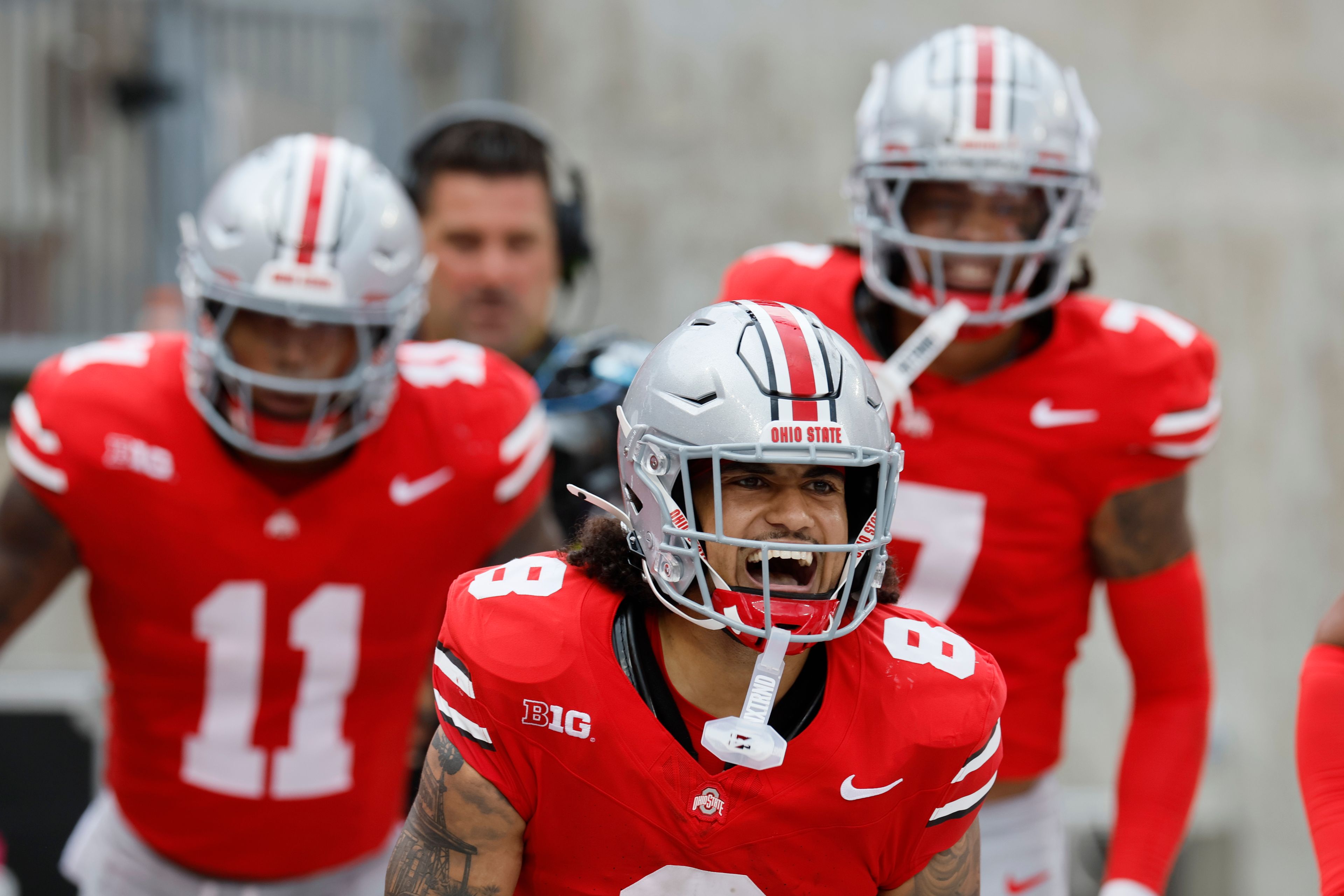 Ohio State defensive back Lathan Ransom, front, celebrates his touchdown against Akron during the second half of an NCAA college football game Saturday, Aug. 31, 2024, in Columbus, Ohio. (AP Photo/Jay LaPrete)