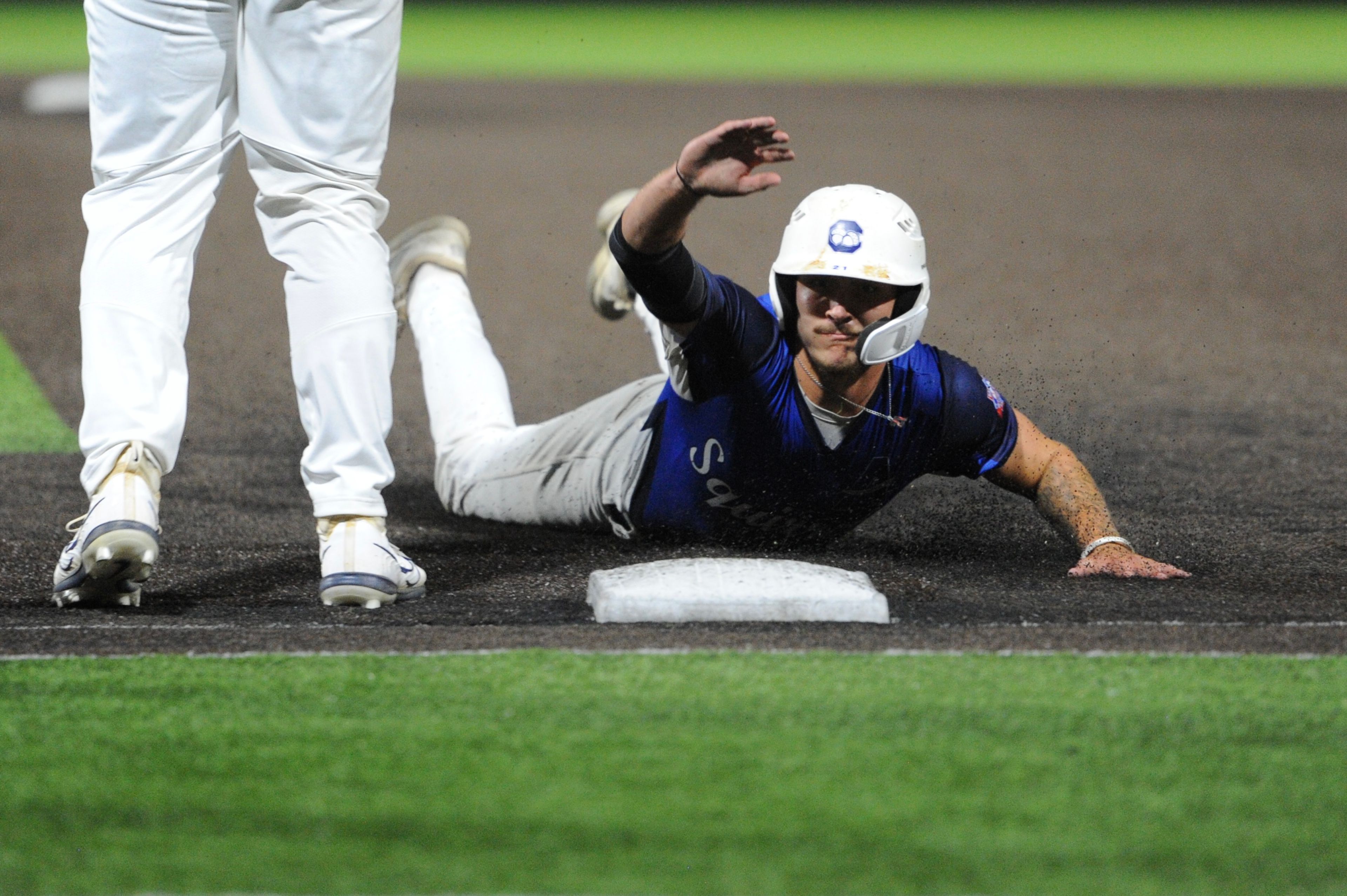 Aycorp's Levi McKinnie swims back to first during a Saturday, August 10, 2024 Babe Ruth World Series game between the Aycorp Fighting Squirrels and Manassas, Virginia, at Capaha Field in Cape Girardeau, Mo. Aycorp defeated Manassas, 3-1.