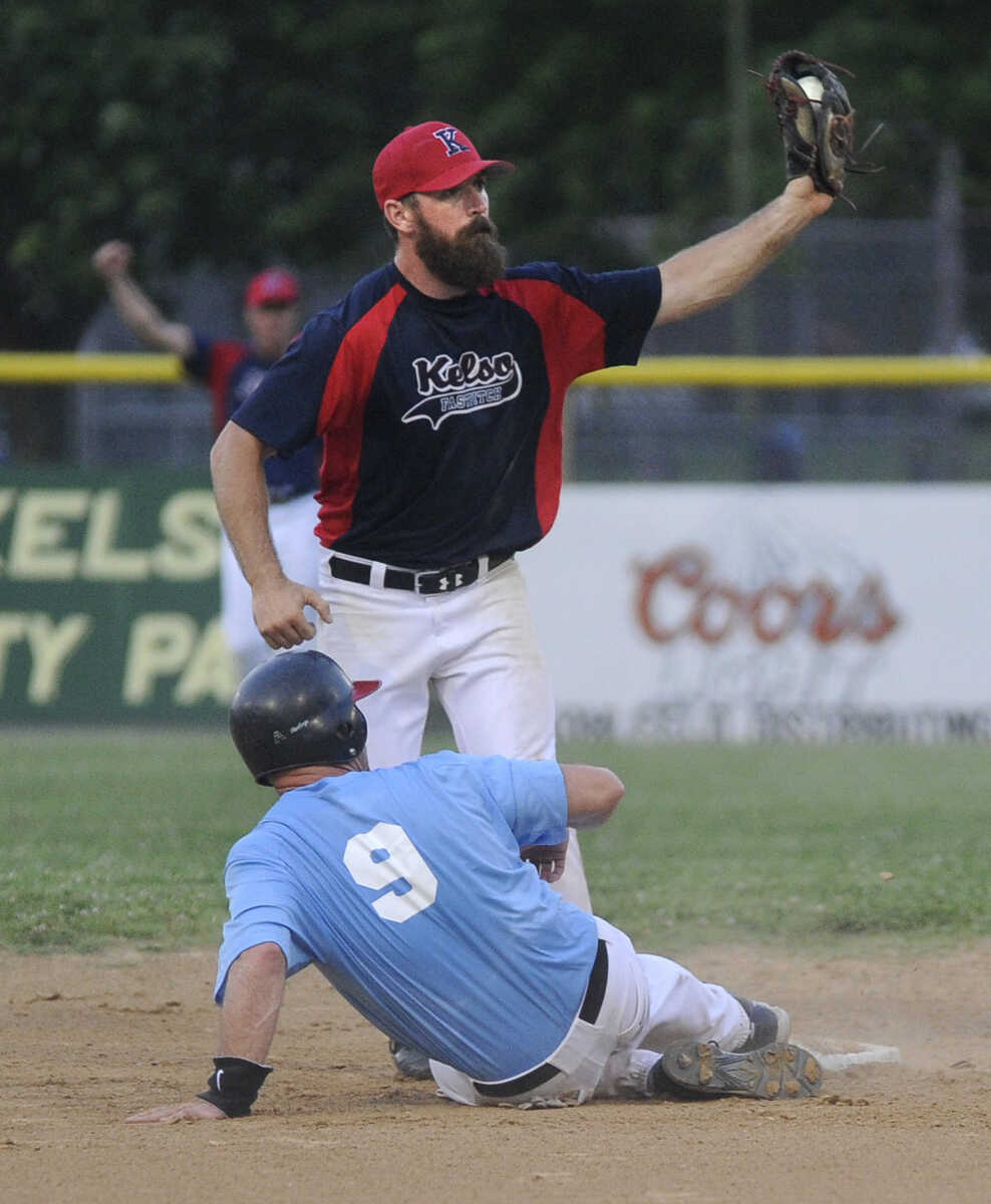 FRED LYNCH ~ flynch@semissourian.com
Kelso Fast Pitch shortstop Chad Stelling looks for the call but The Clubhouse's Doug Bryan was ruled safe on the play at second base during the second inning Friday, June 8, 2018 at the Kelso Klassic in Kelso, Missouri.