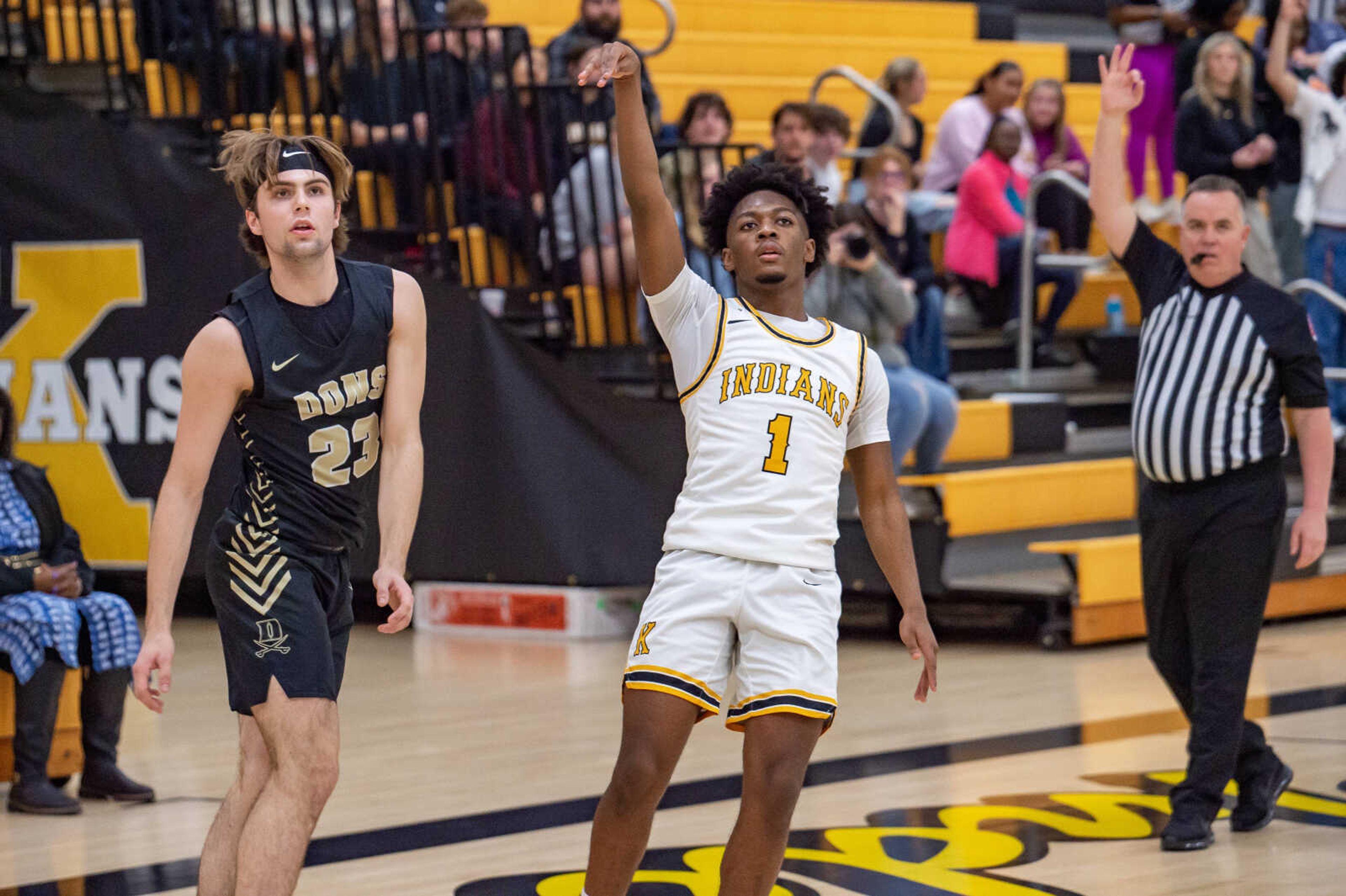 Kennett sophomore Ty Jones (1) watches the ball fly as he shoots a 3-pointer in Thursday night's game against Doniphan. 