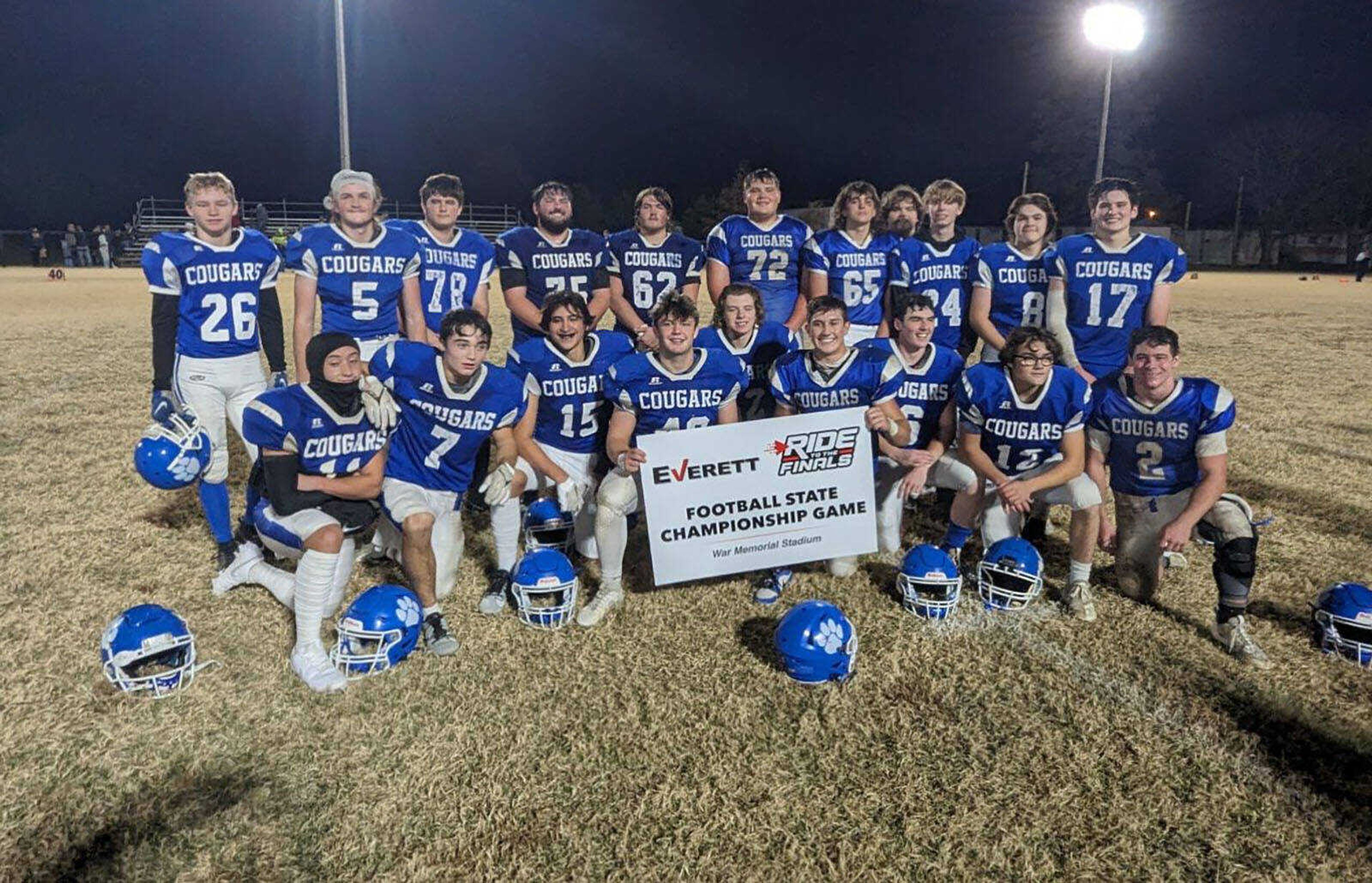 The Rector (Ark.) High School football team smiles as the Cougars receive their “ticket” to the 8-man state championship game slated for Nov. 30 in Little Rock.