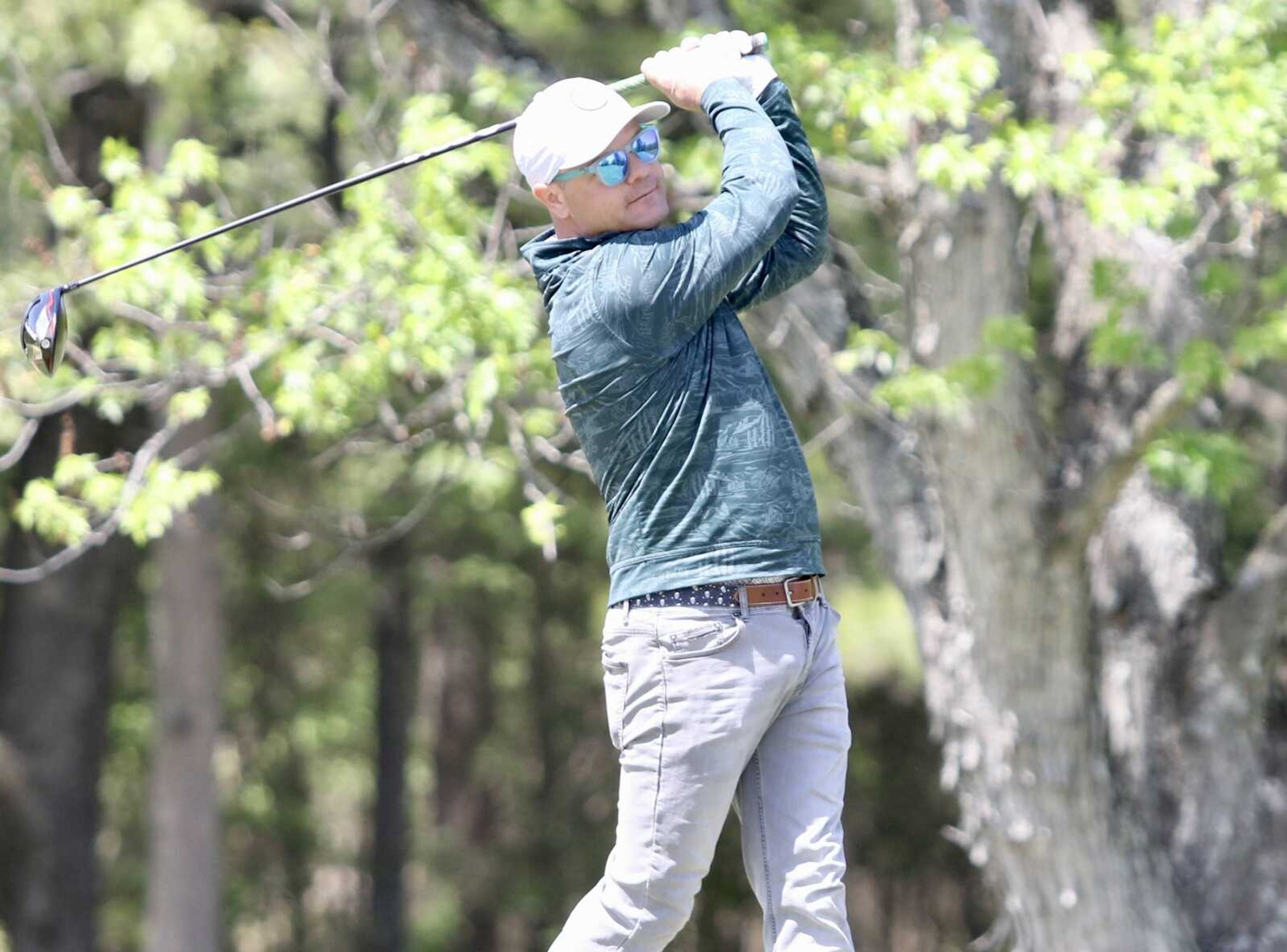 Joshua Rhodes of Paducah, Kentucky, tees off Saturday at Westwood Hills Country Club during the 77th Tom Hoover Ozark Invitational opening round. Rhodes tied for first place by shooting a 1-under-par 70 and will be in the final group to tee off in the second round Sunday.