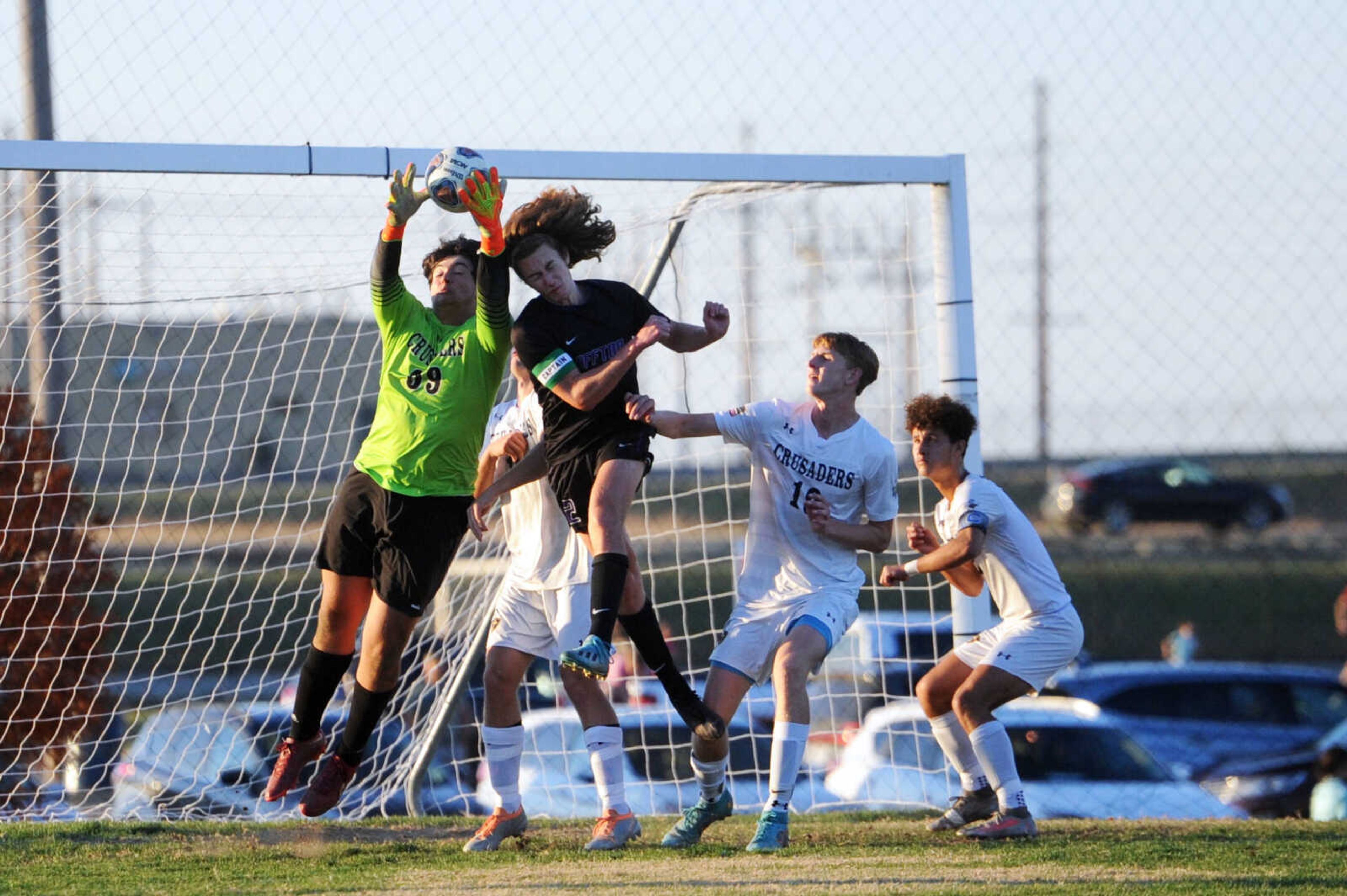 Saxony Lutheran's Aaron Zoellner makes a save on Thursday in the Class 2 District 1 championship at The Bank of Missouri Soccer Complex in Perryville.