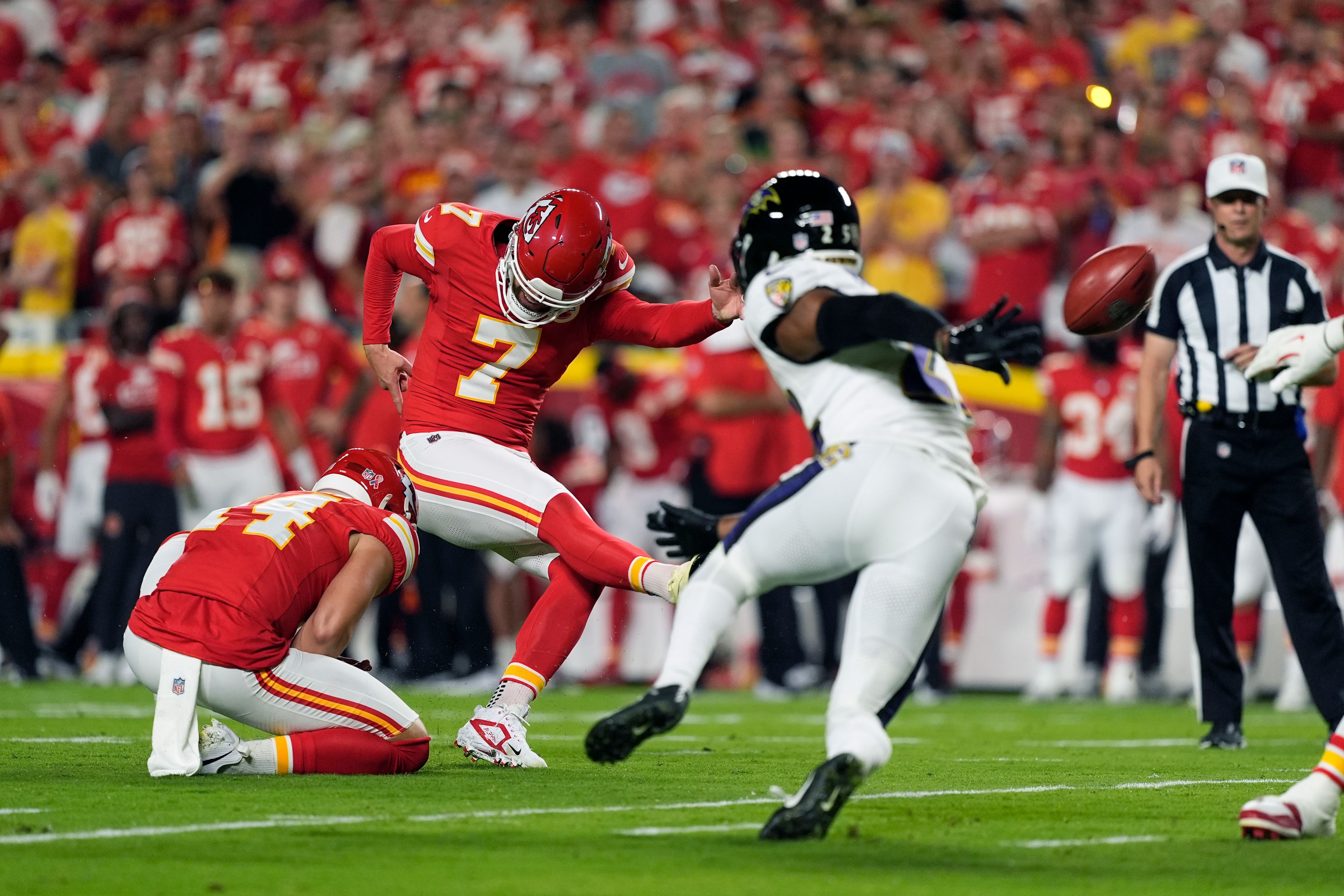 Kansas City Chiefs kicker Harrison Butker (7) makes a 32-yard field goal during the first half of an NFL football game against the Baltimore Ravens Thursday, Sept. 5, 2024, in Kansas City, Mo. (AP Photo/Charlie Riedel)