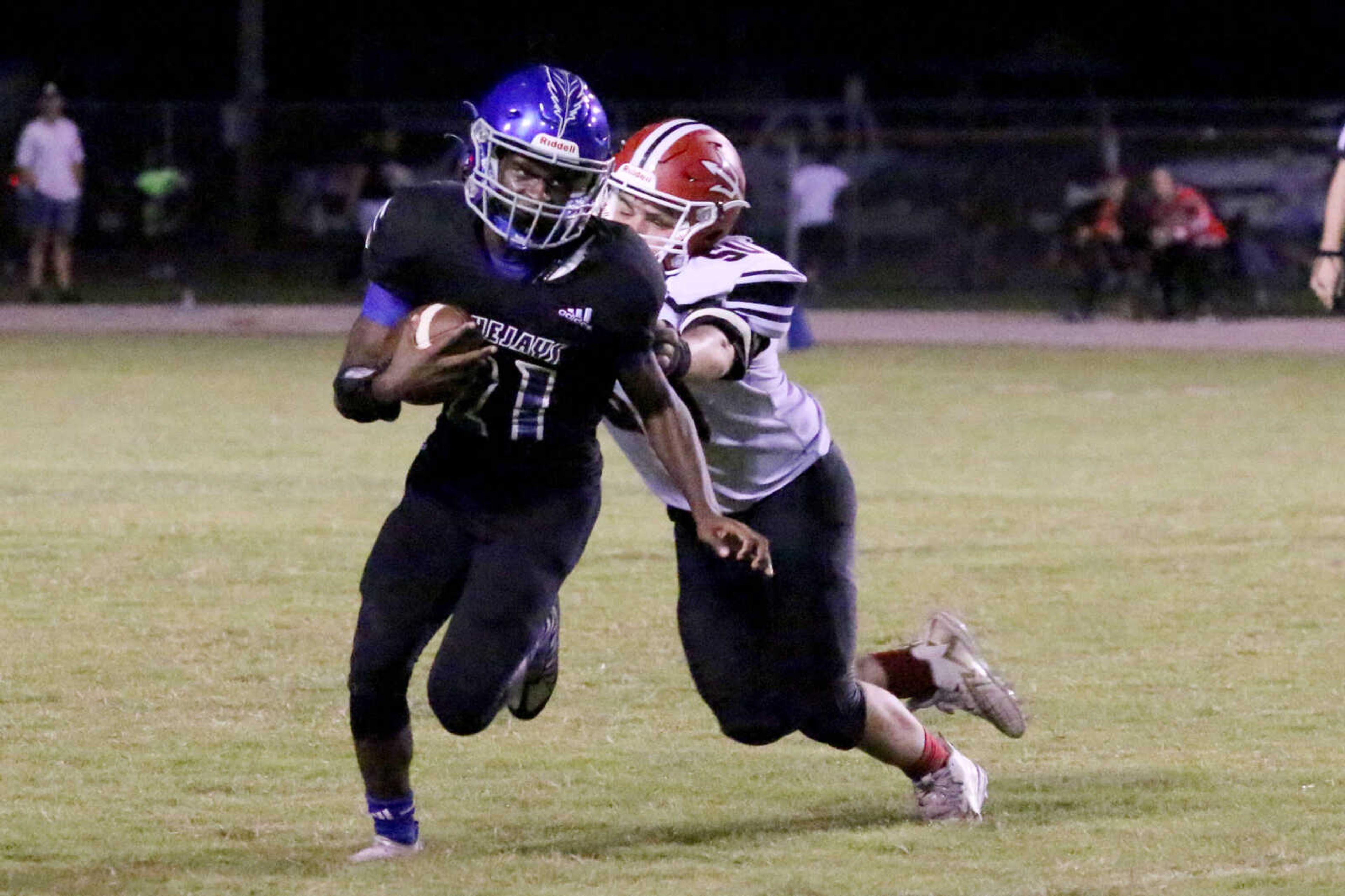 Charleston's J'Maurion Robinson (21) runs&nbsp;during a 14-12 loss to Chaffee at John Harris Marshall Stadium on Thursday, August 31, 2023.&nbsp;