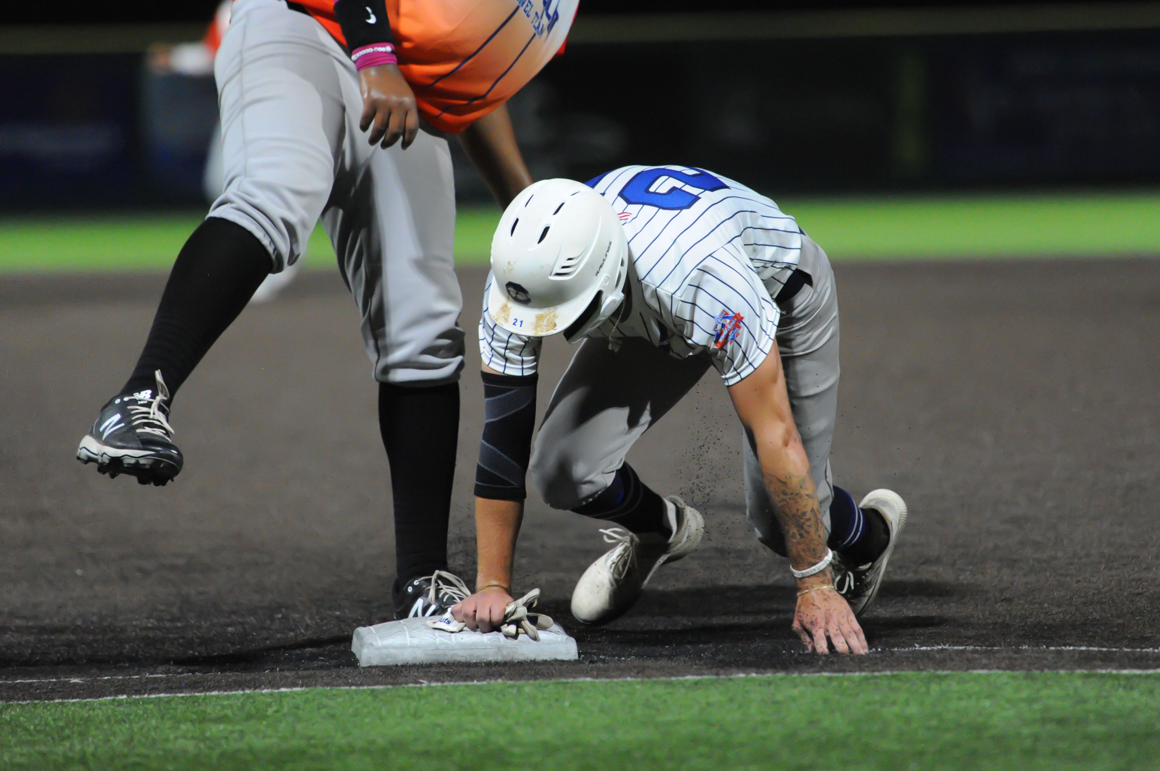 Aycorp's Luke Hester gets back to first safely during a Tuesday, August 13, 2024 Babe Ruth World Series game between the Aycorp Fighting Squirrels and Holland Henson of the Netherlands at Capaha Field in Cape Girardeau, Mo. Aycorp defeated the Netherlands, 12-2 in five innings.